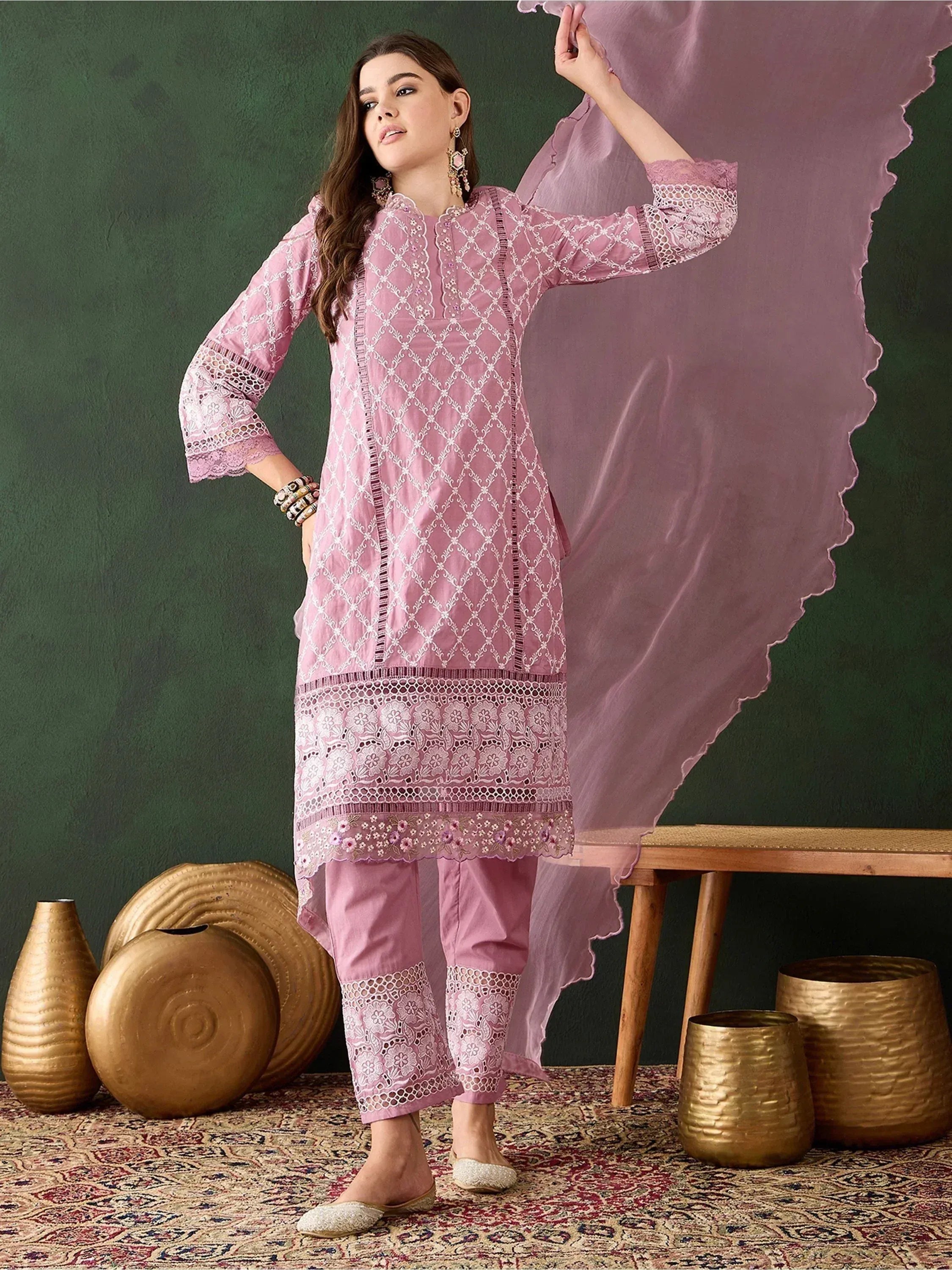 Pink embroidered salwar kameez with lace detailing, paired with matching dupatta and palazzo pants