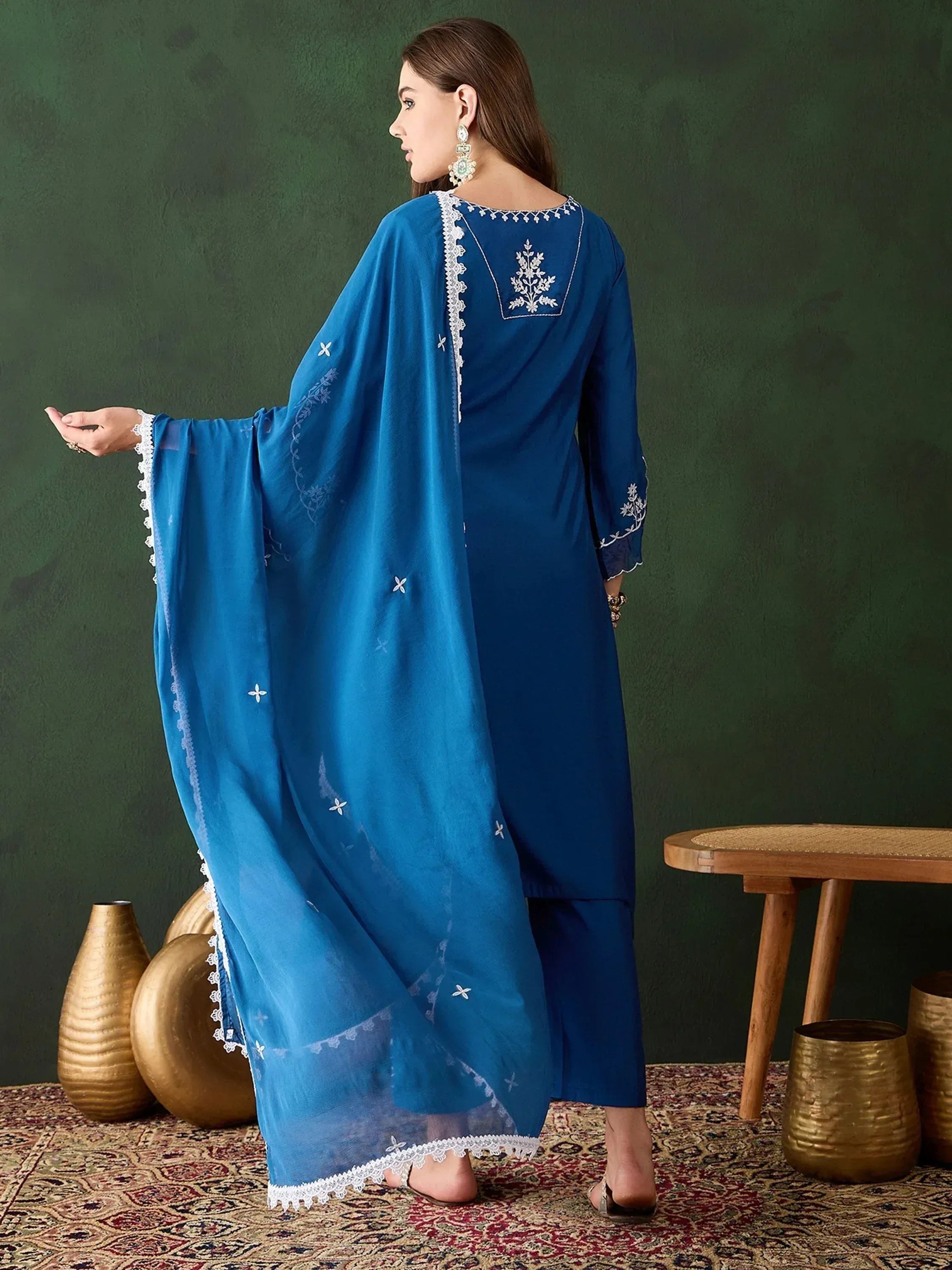 Blue embroidered salwar kameez with lace detailing, perfect for ethnic occasions