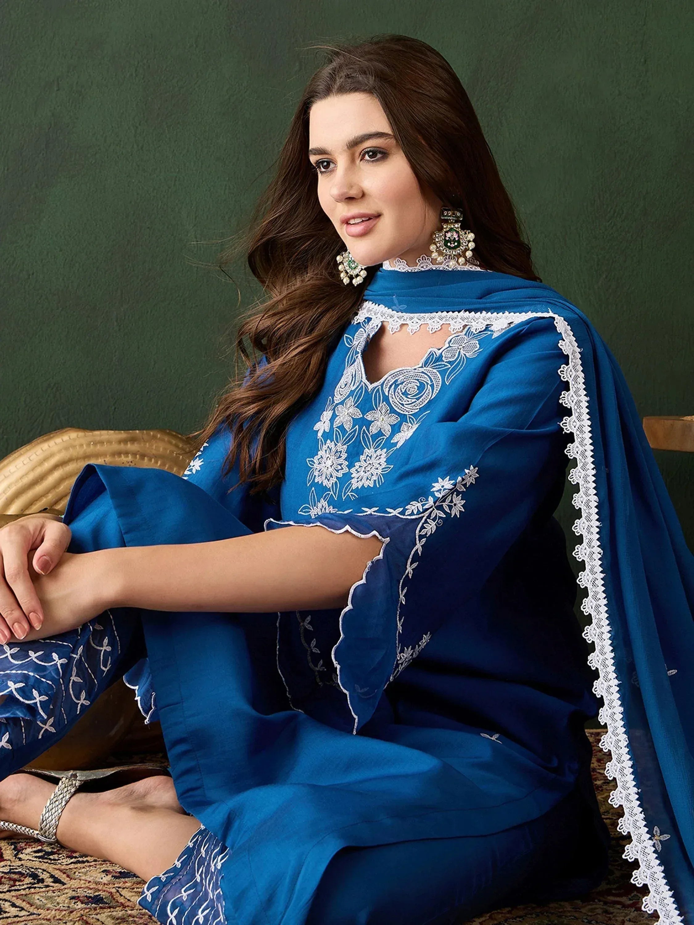 Elegant blue embroidered salwar kameez with lace detailing, perfect for ethnic occasions.