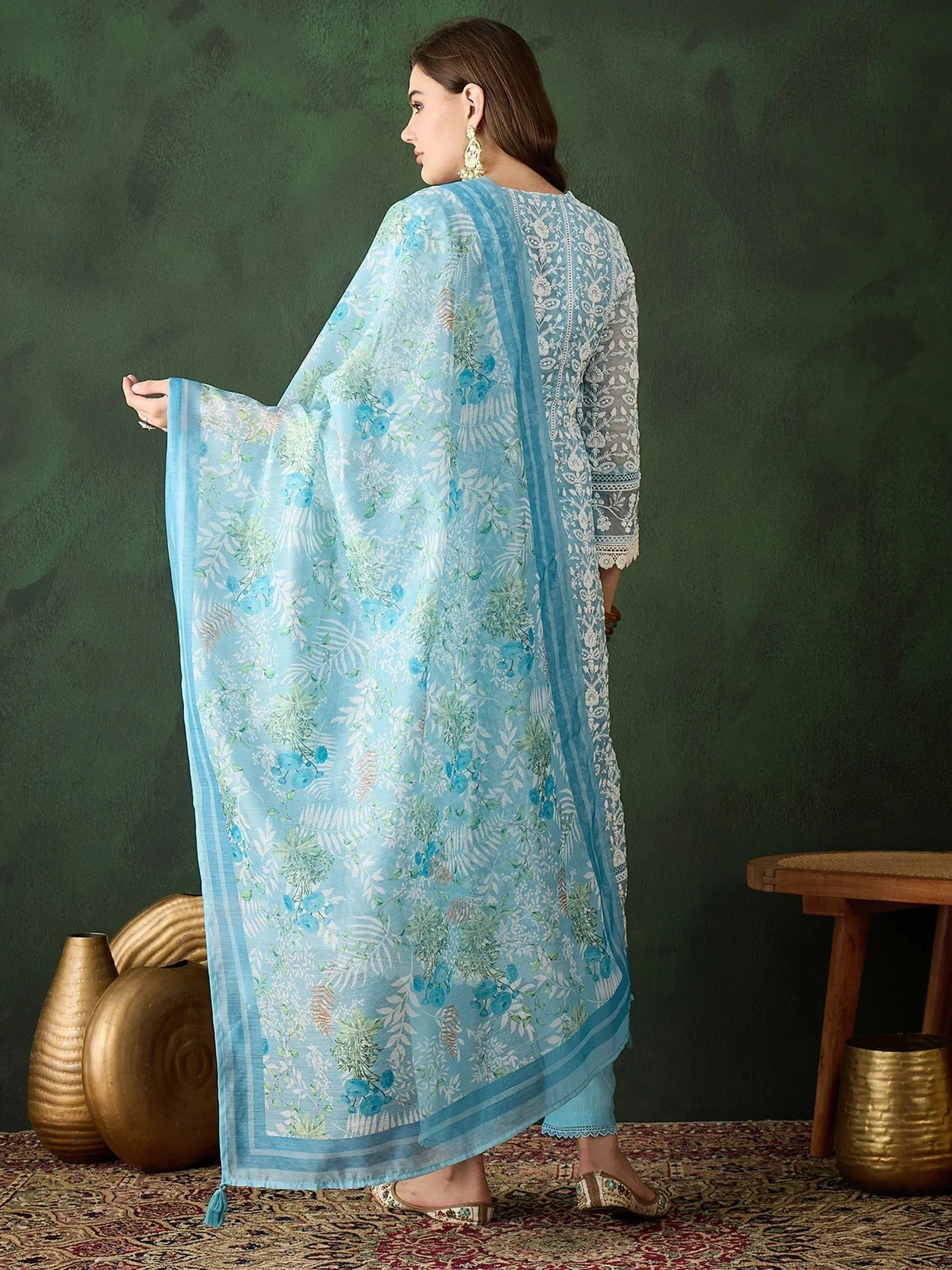 Light blue floral printed salwar kameez with lace detailing, perfect for ethnic wear occasions