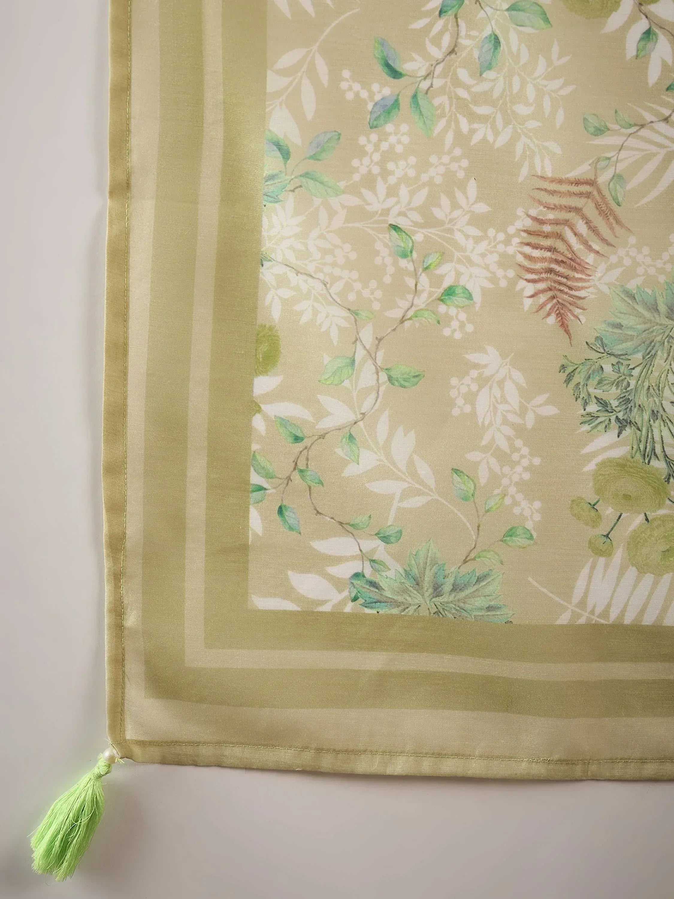 Green floral printed ethnic dupatta with tassel detail, perfect for saree or salwar kameez outfits