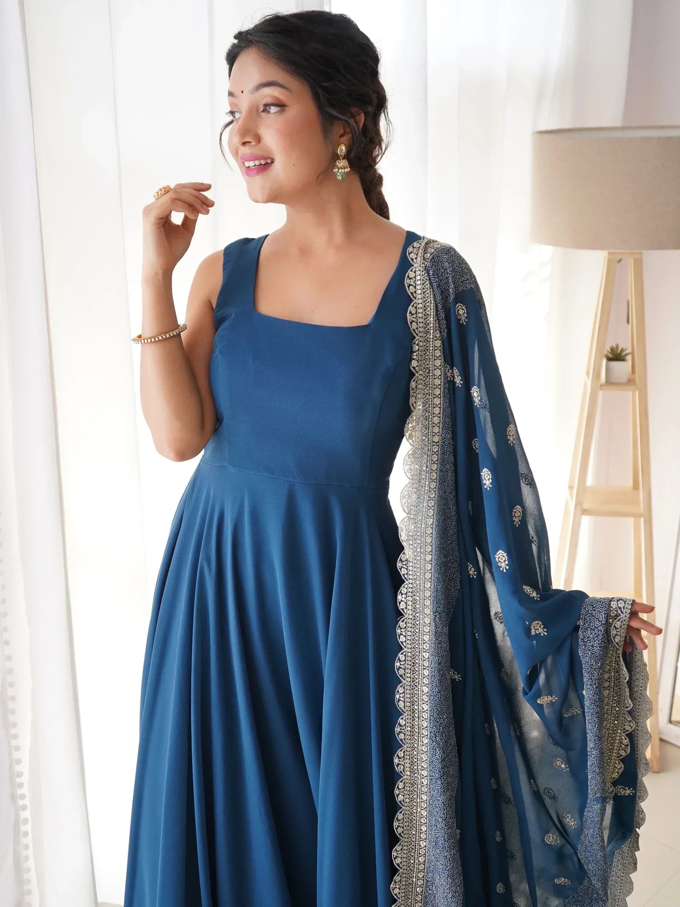 Blue ethnic gown with embroidered dupatta, perfect for Indian occasions and festive wear.