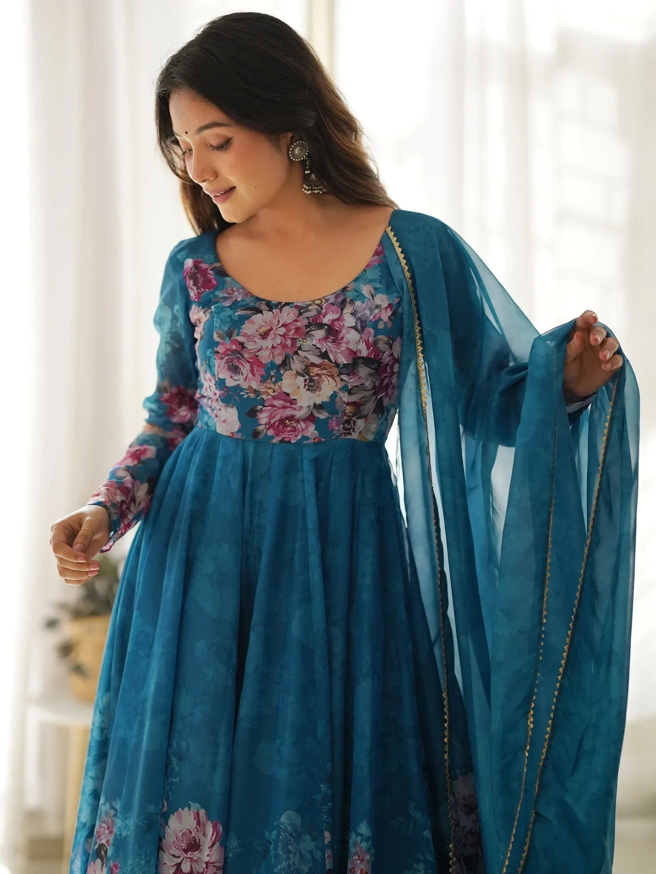 Teal floral print ethnic gown with matching dupatta, perfect for Indian occasions and festive wear.