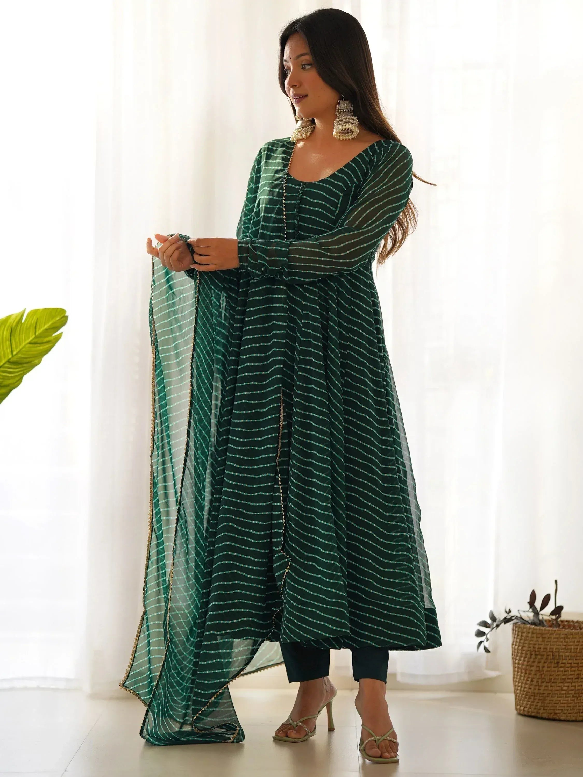 Green striped ethnic kurta with matching dupatta, styled with palazzo pants and statement earrings
