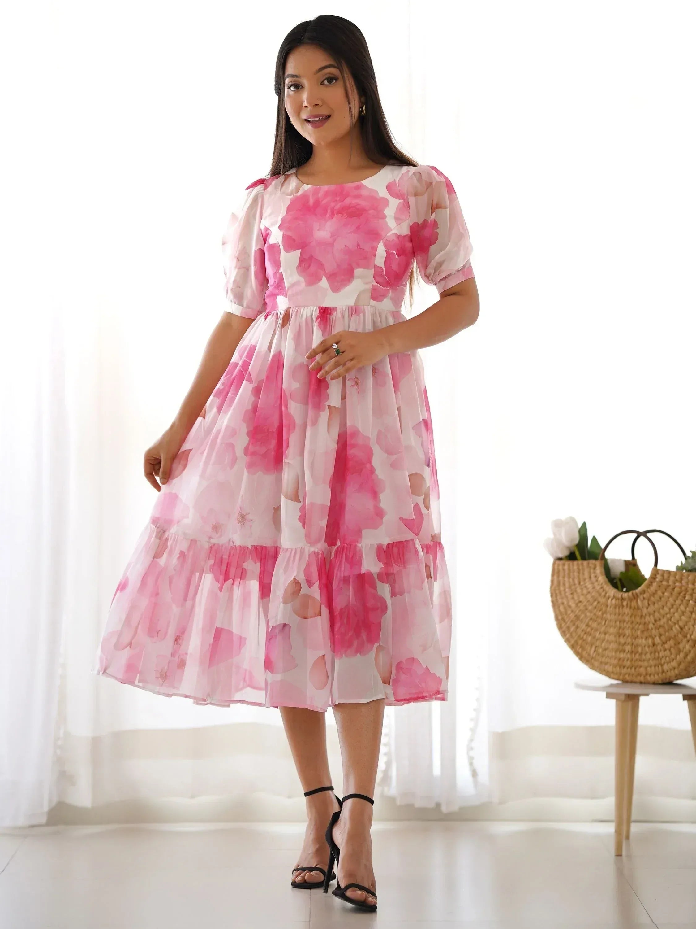Pink floral ethnic gown with tiered skirt and puff sleeves, perfect for festive occasions