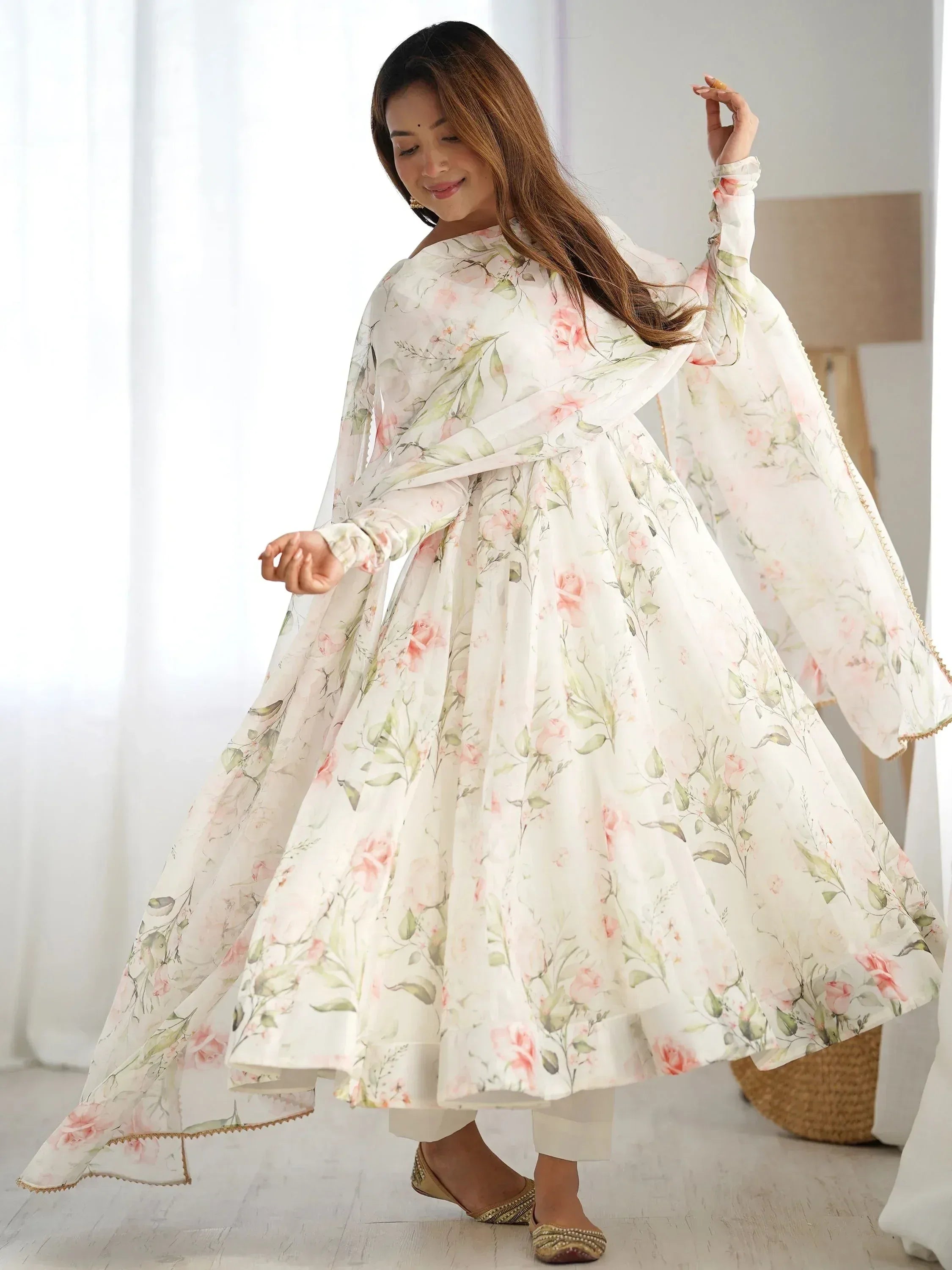 Floral print ethnic gown with flared skirt and bell sleeves, perfect for Indian occasions