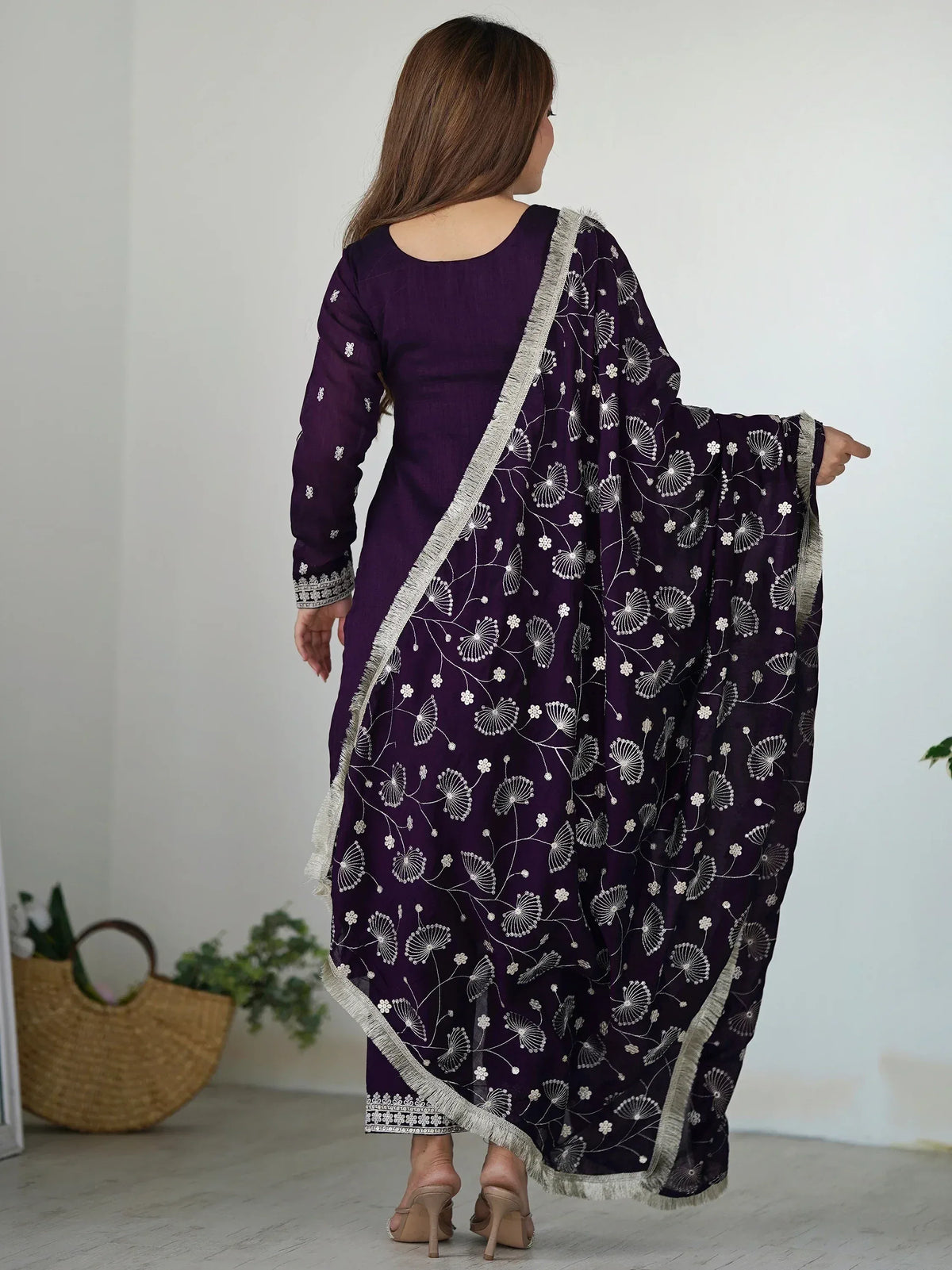 Purple ethnic salwar kameez with white floral embroidery and fringed dupatta, stylish Indian wear