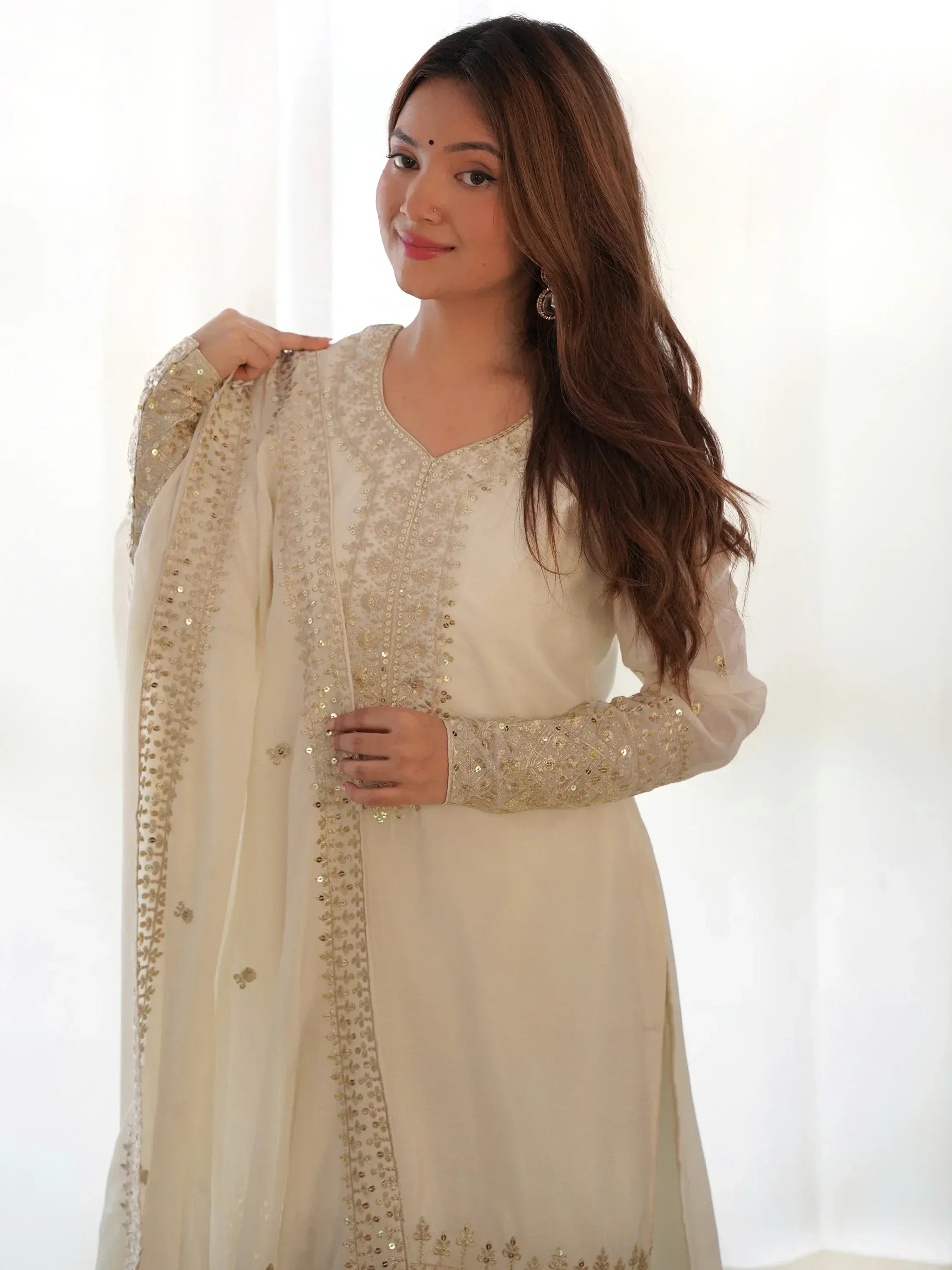 Elegant ivory ethnic kurti with gold sequin embroidery, perfect for Indian festive occasions