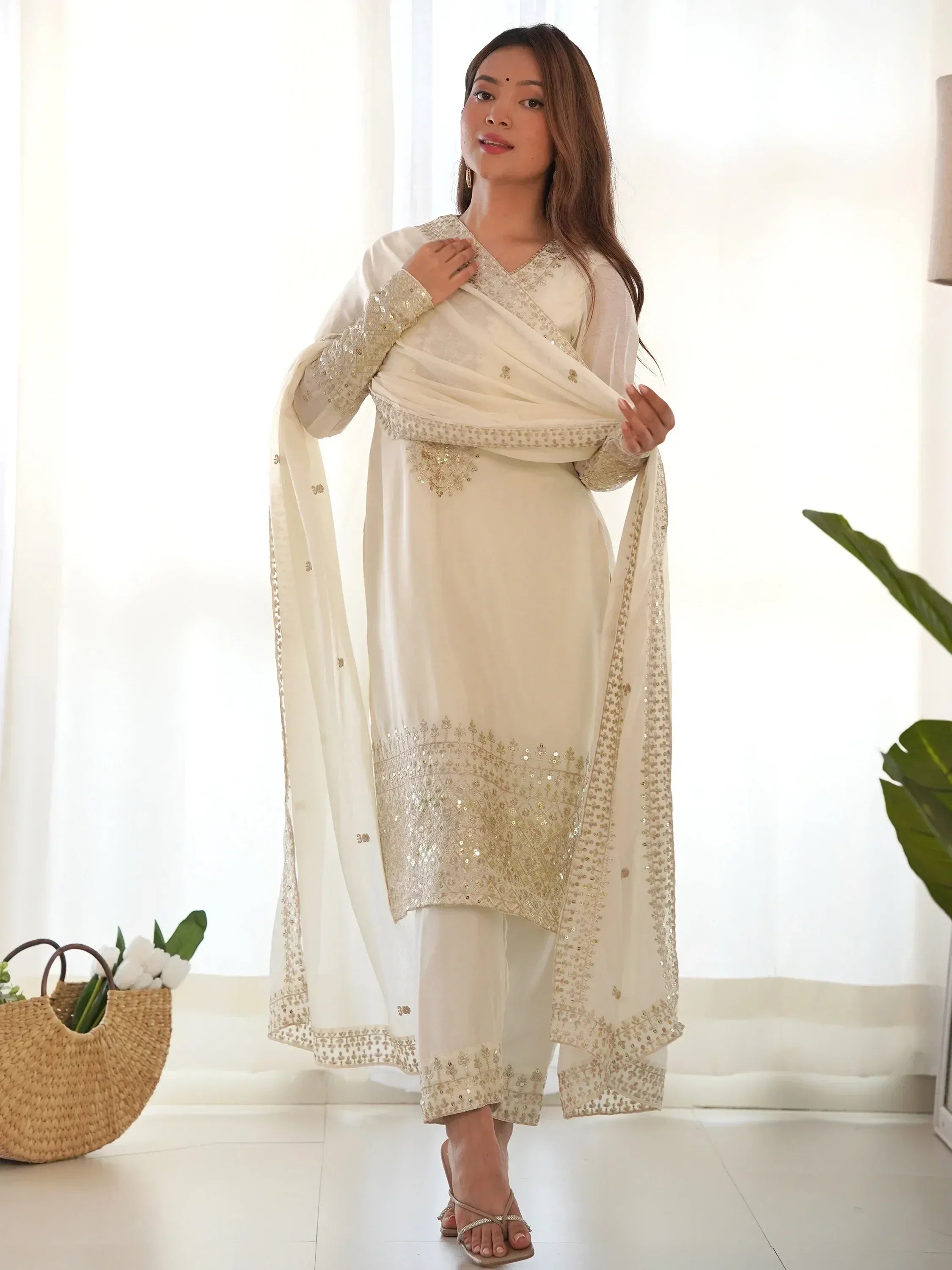 Elegant ivory salwar kameez with gold embroidery, perfect for Indian ethnic wear occasions