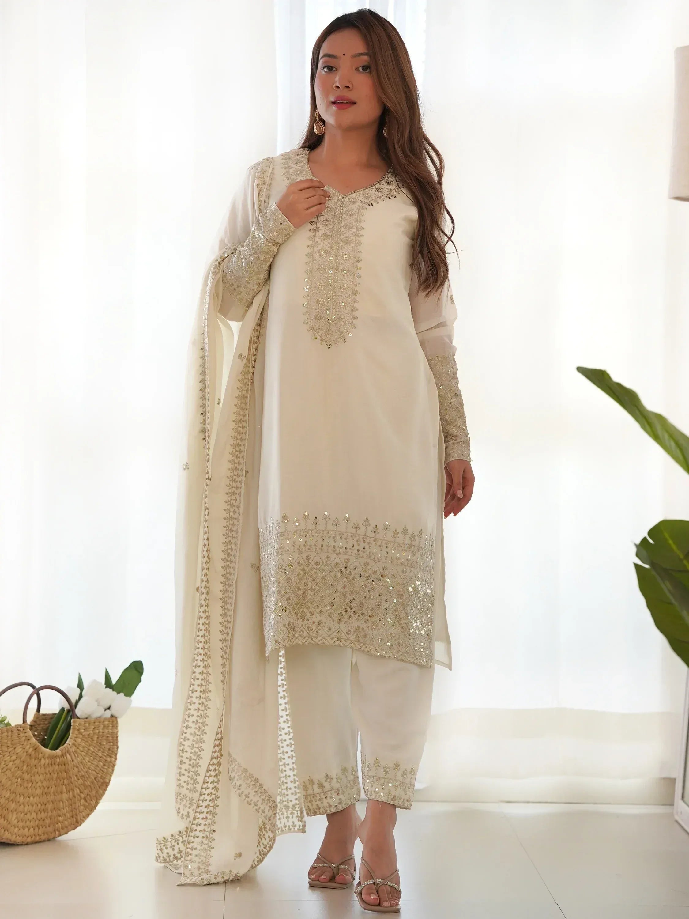 Cream embroidered salwar kameez with sequin work, perfect for Indian ethnic wear occasions