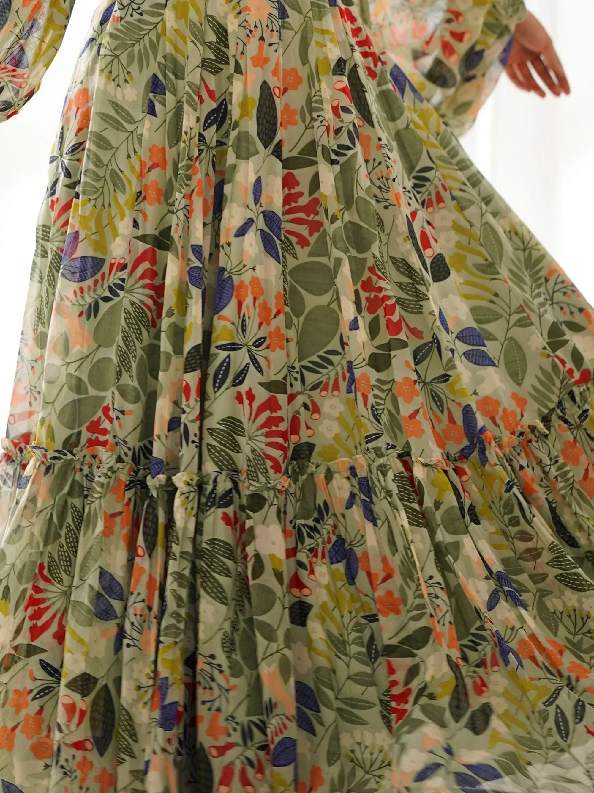 Floral print ethnic gown with pleated skirt, vibrant botanical pattern for women's festive wear