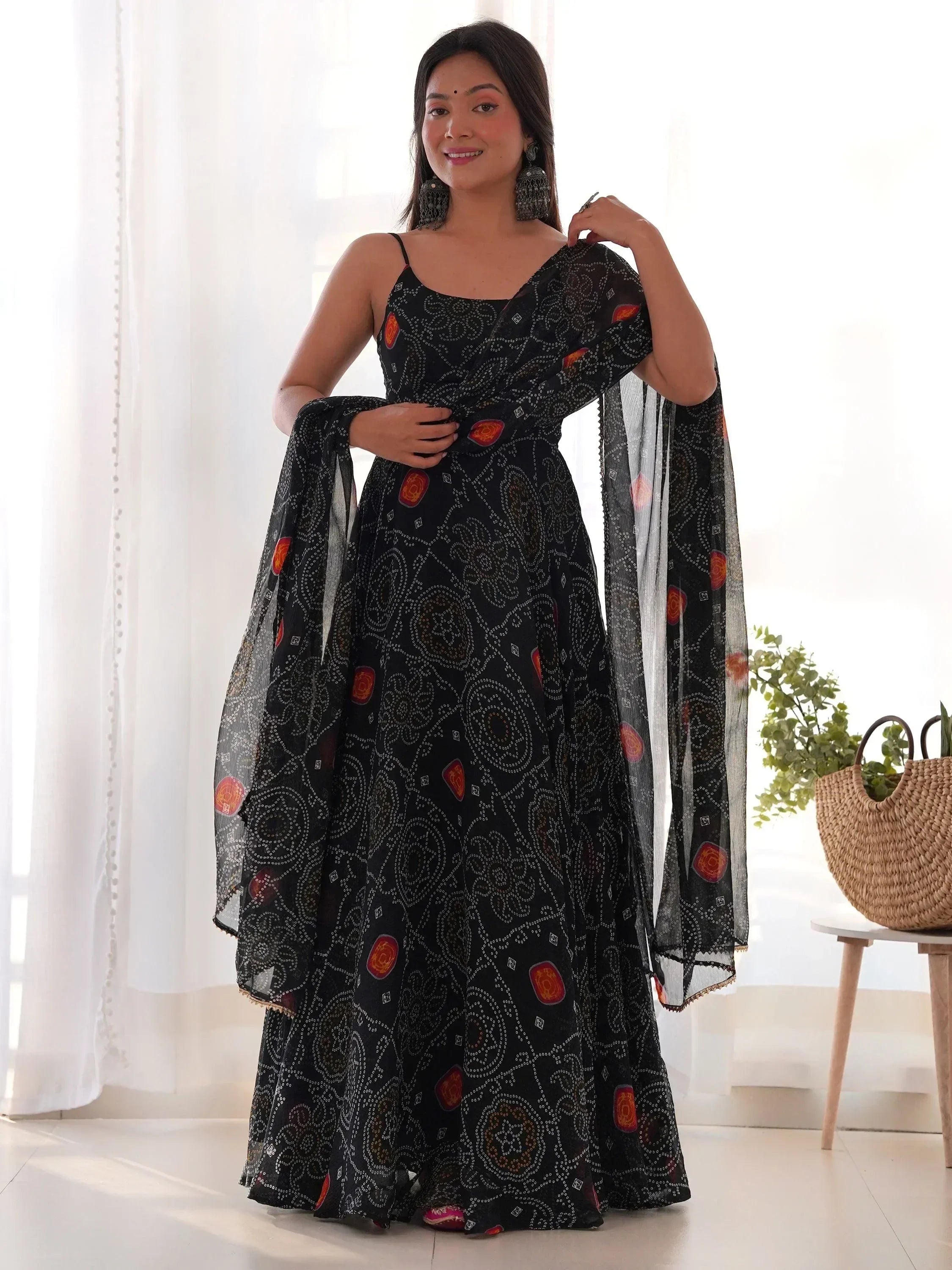 Black printed ethnic gown with sheer dupatta, perfect for Indian occasions and festive wear.
