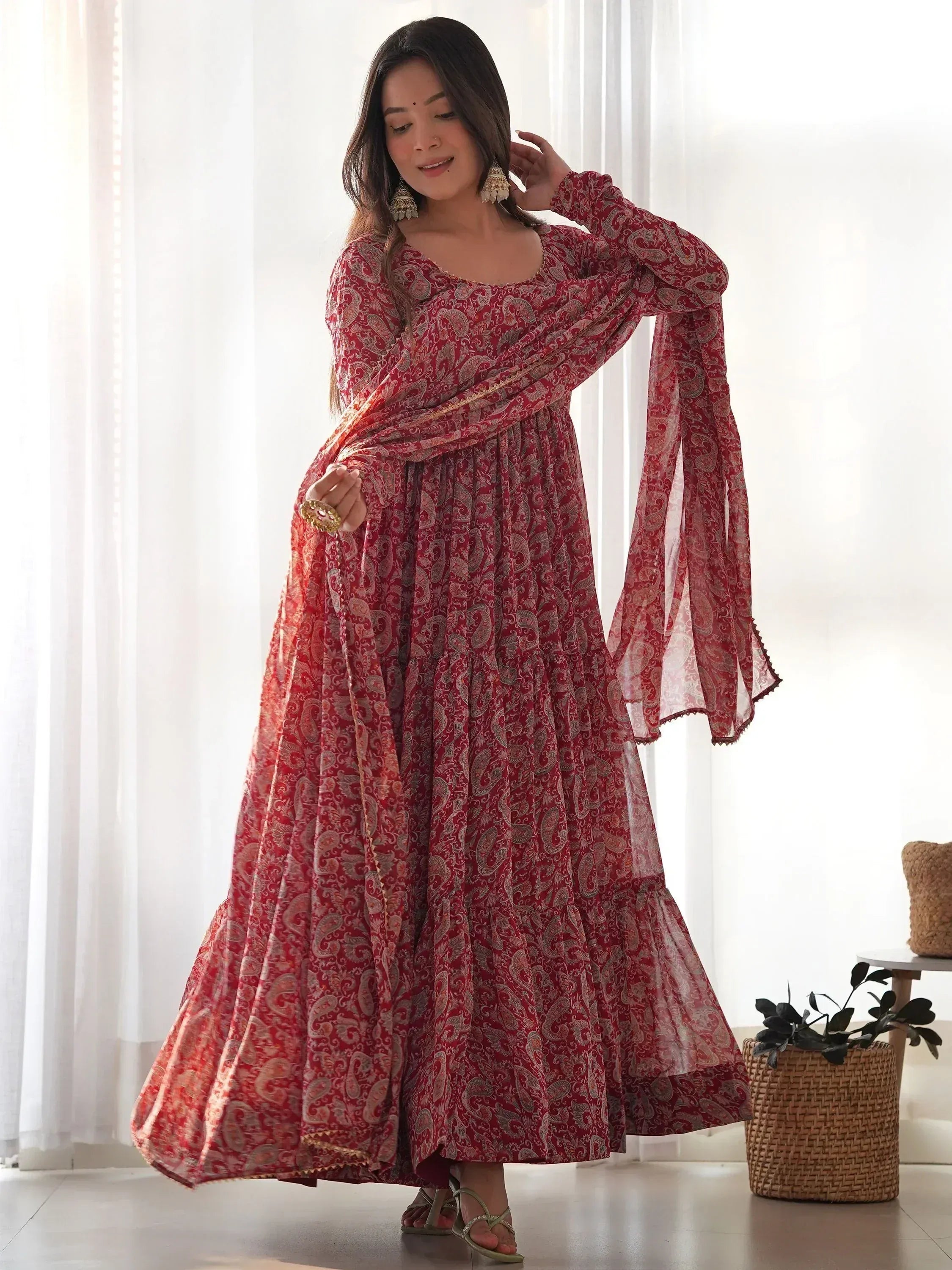 Red paisley print ethnic gown with flared sleeves and dupatta, perfect for Indian occasions