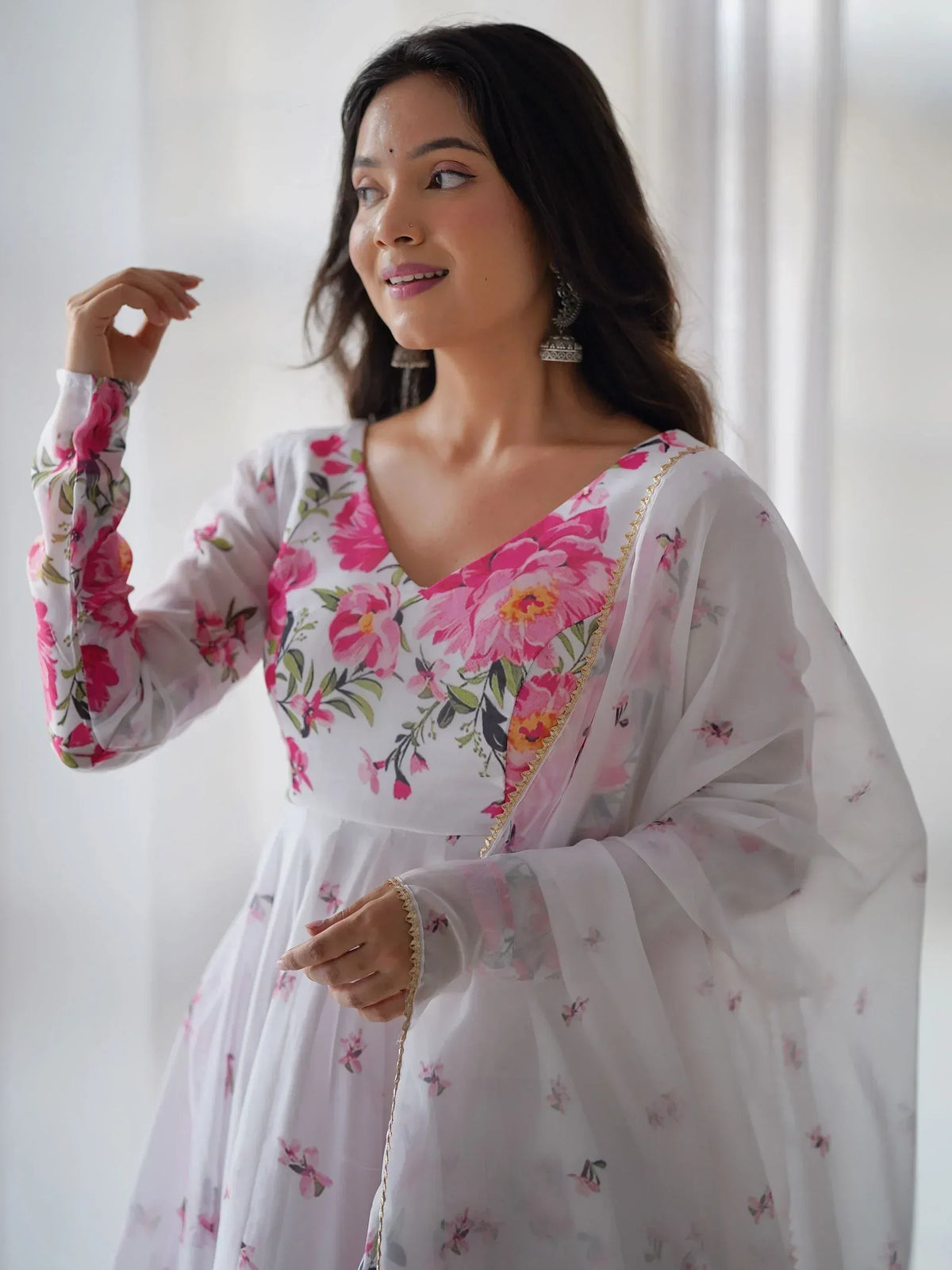 White floral ethnic gown with pink peony print and gold trim, perfect for Indian occasions