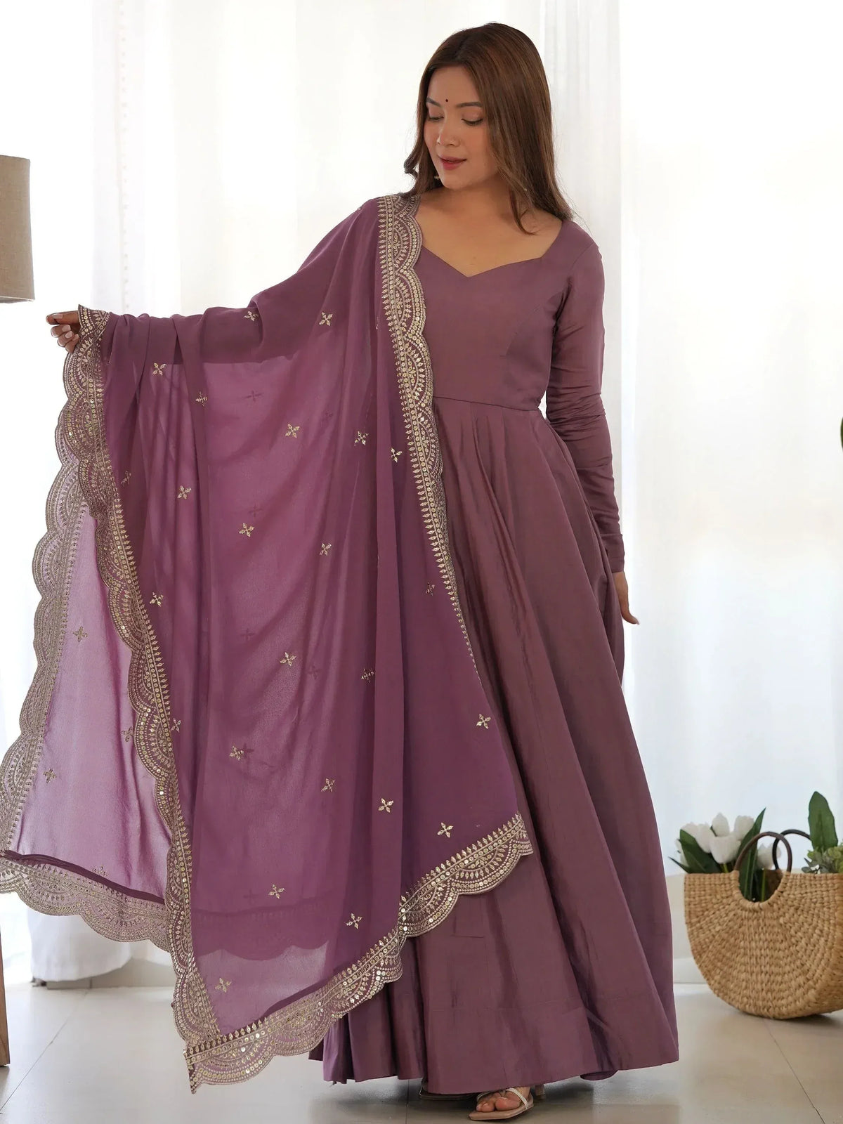 Mauve Indian ethnic anarkali suit with gold embroidery and dupatta, perfect for festive occasions