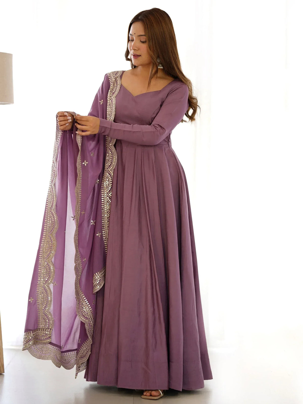 Purple ethnic gown with gold embroidery and matching dupatta, perfect for Indian occasions