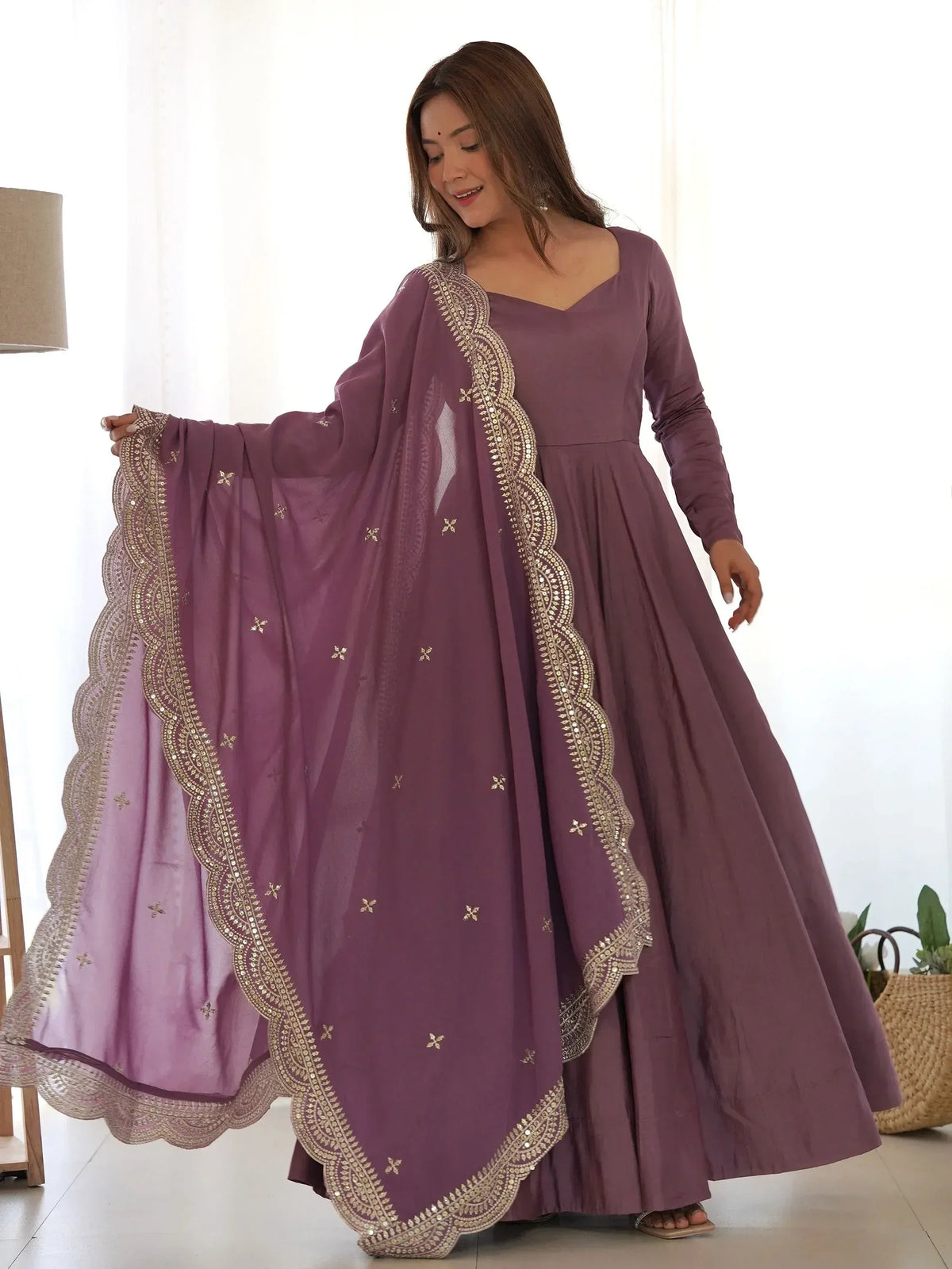 Purple ethnic anarkali gown with gold embroidery and matching dupatta, perfect for Indian occasions.