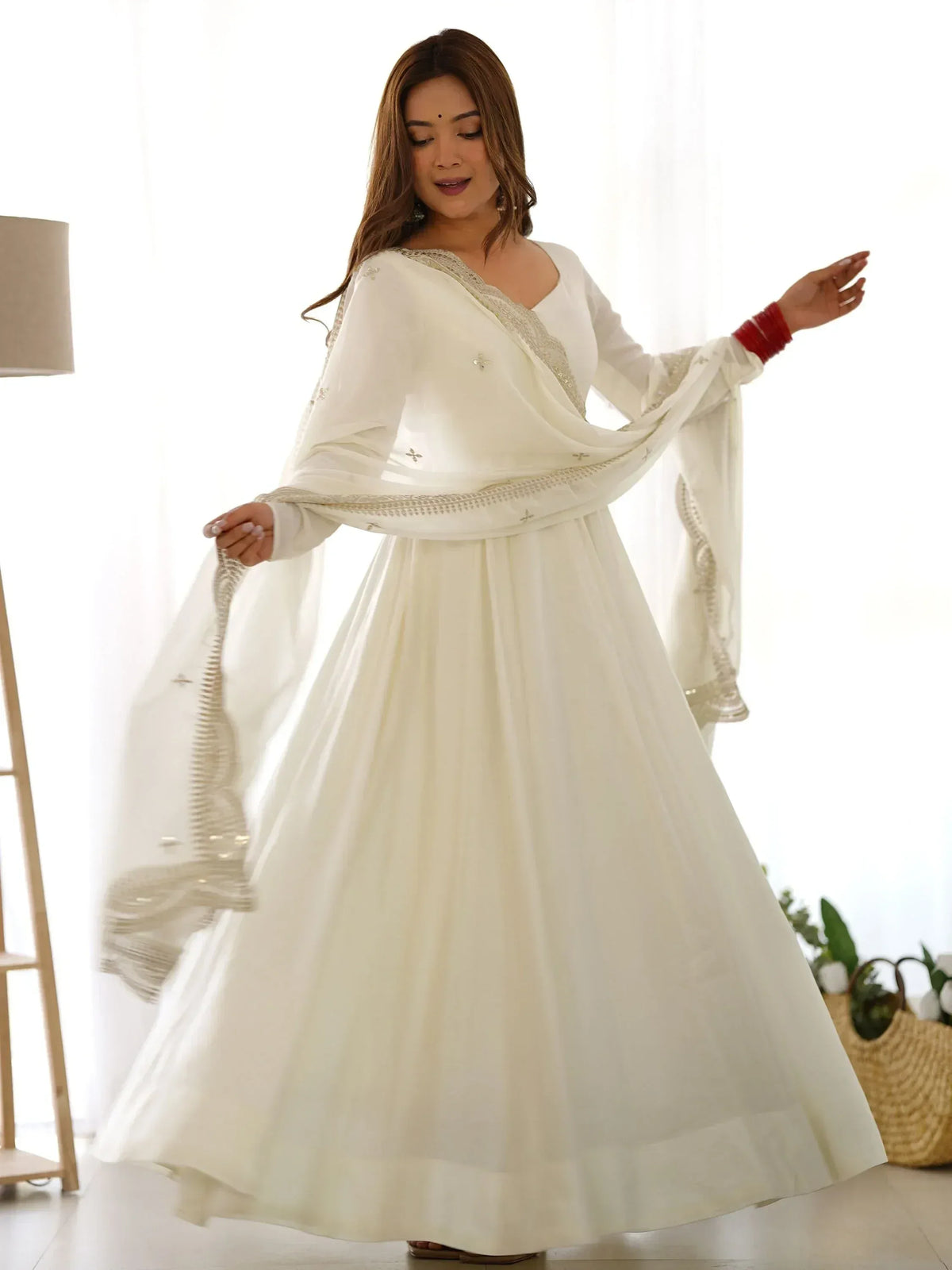 White ethnic anarkali suit with embroidery, perfect for Indian occasions and festive wear