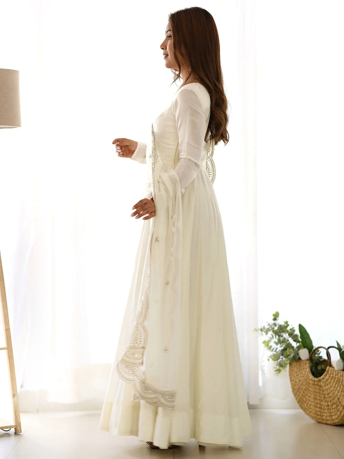 Elegant white ethnic gown with intricate embroidery, perfect for Indian festive occasions and weddings.
