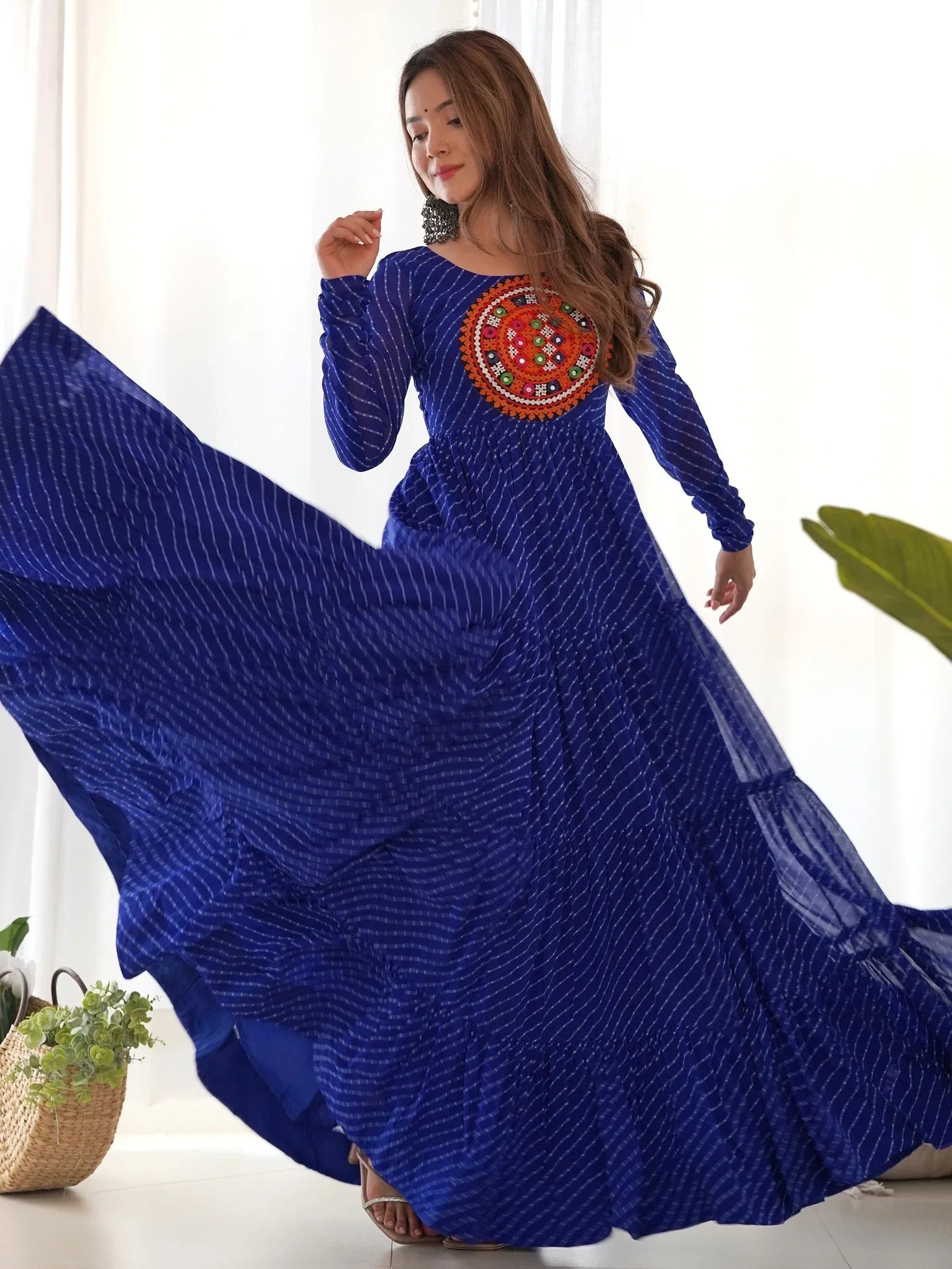 Blue ethnic gown with mirror work, perfect for Indian festive occasions and weddings