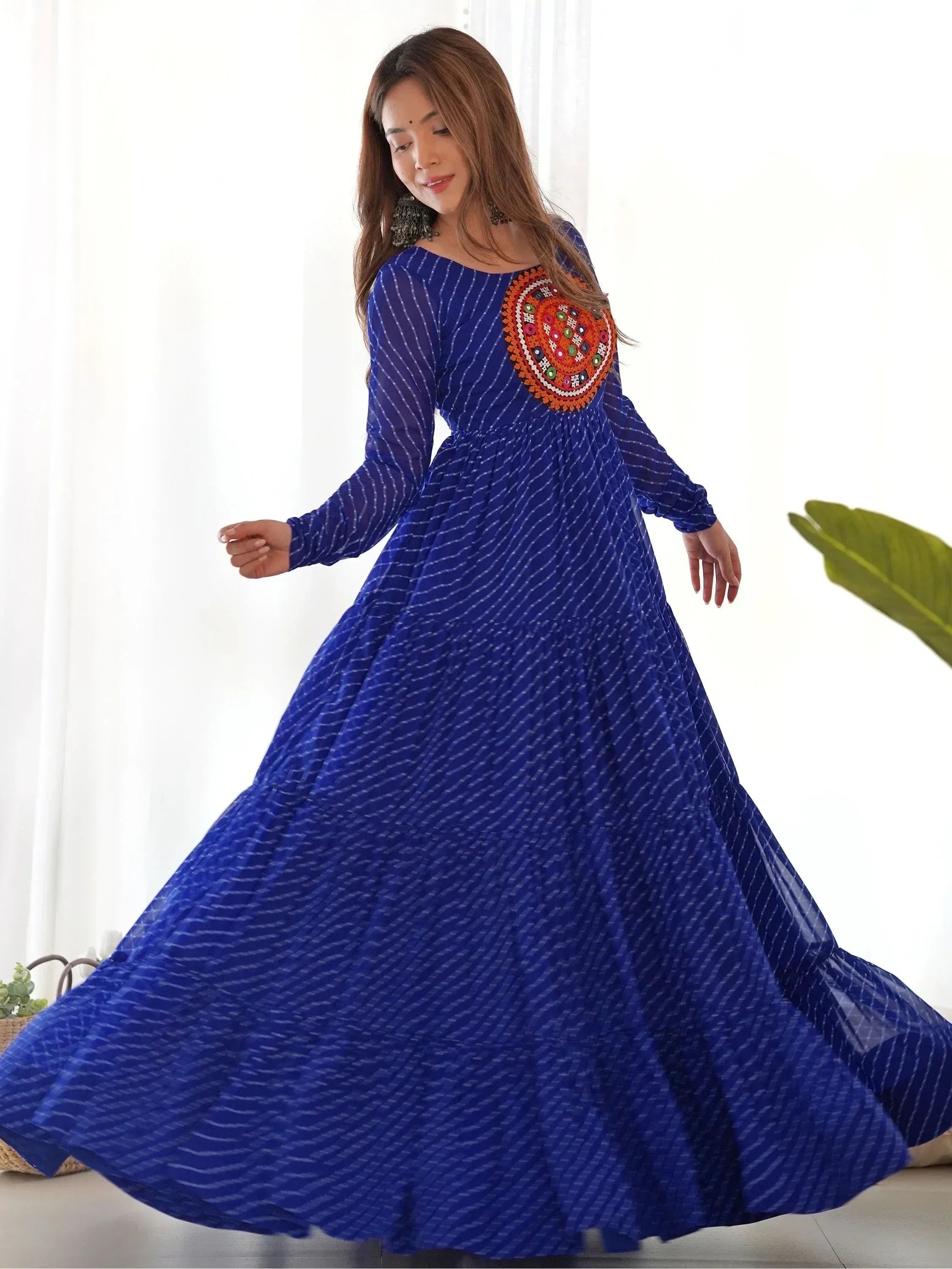 Blue ethnic gown with embroidered yoke, long sleeves, and flared skirt for women