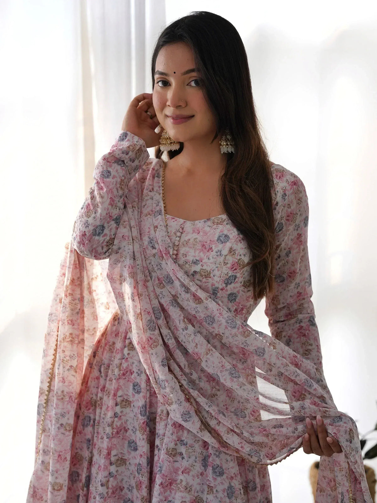 Woman in floral print Indian ethnic gown with dupatta, perfect for festive occasions and parties