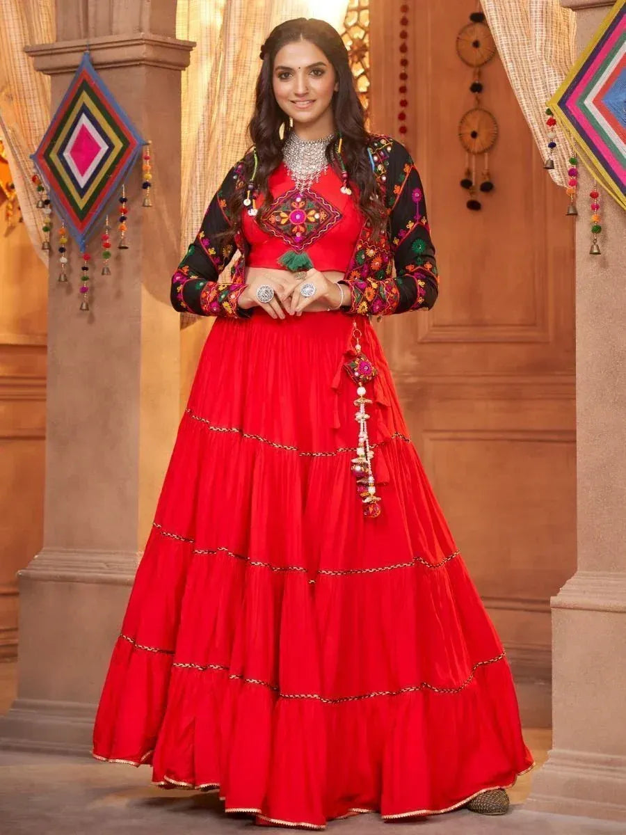 Red embroidered lehenga choli with black floral jacket, perfect for Indian ethnic occasions