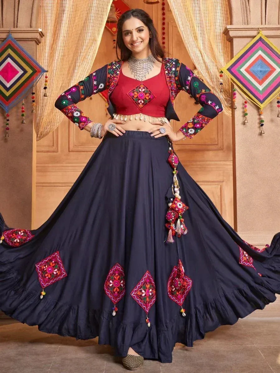 Woman in navy blue embroidered lehenga choli with red blouse, perfect for Indian ethnic wear occasions