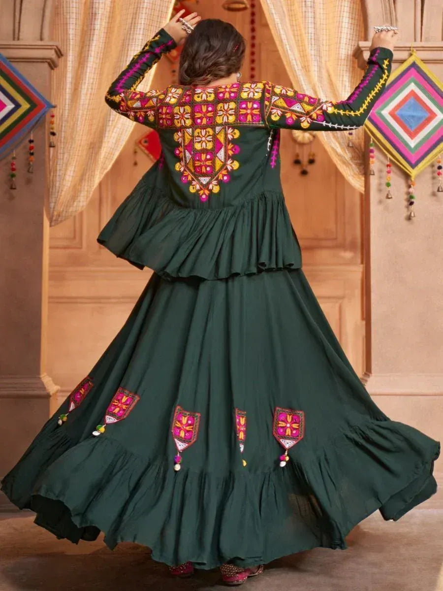 Green ethnic gown with vibrant mirror work and ruffled layers, perfect for Indian festive occasions