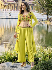 Woman in green embroidered ethnic wear lehenga set posing outdoors near water, Ethnic Plus