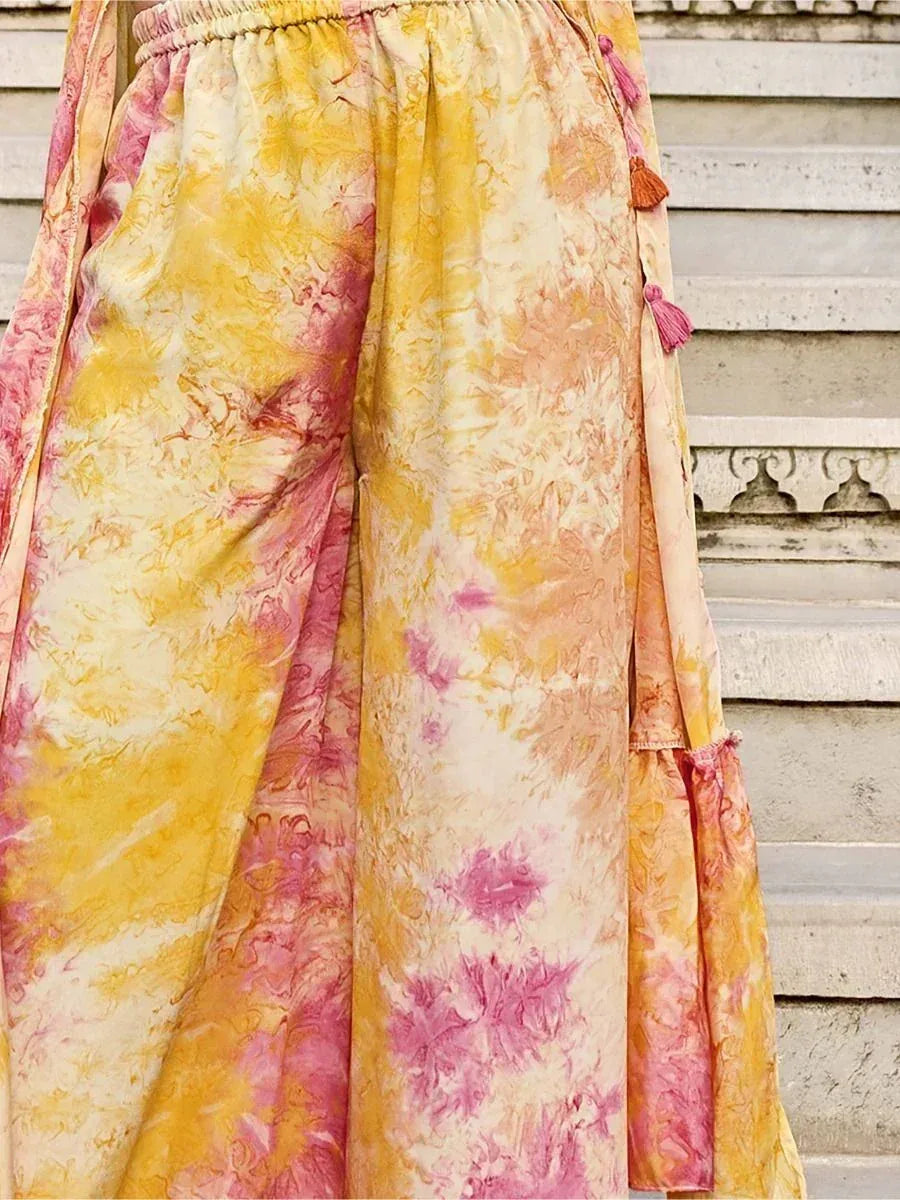 Yellow and pink tie-dye ethnic palazzo pants with tassel detail, outdoor stairs background