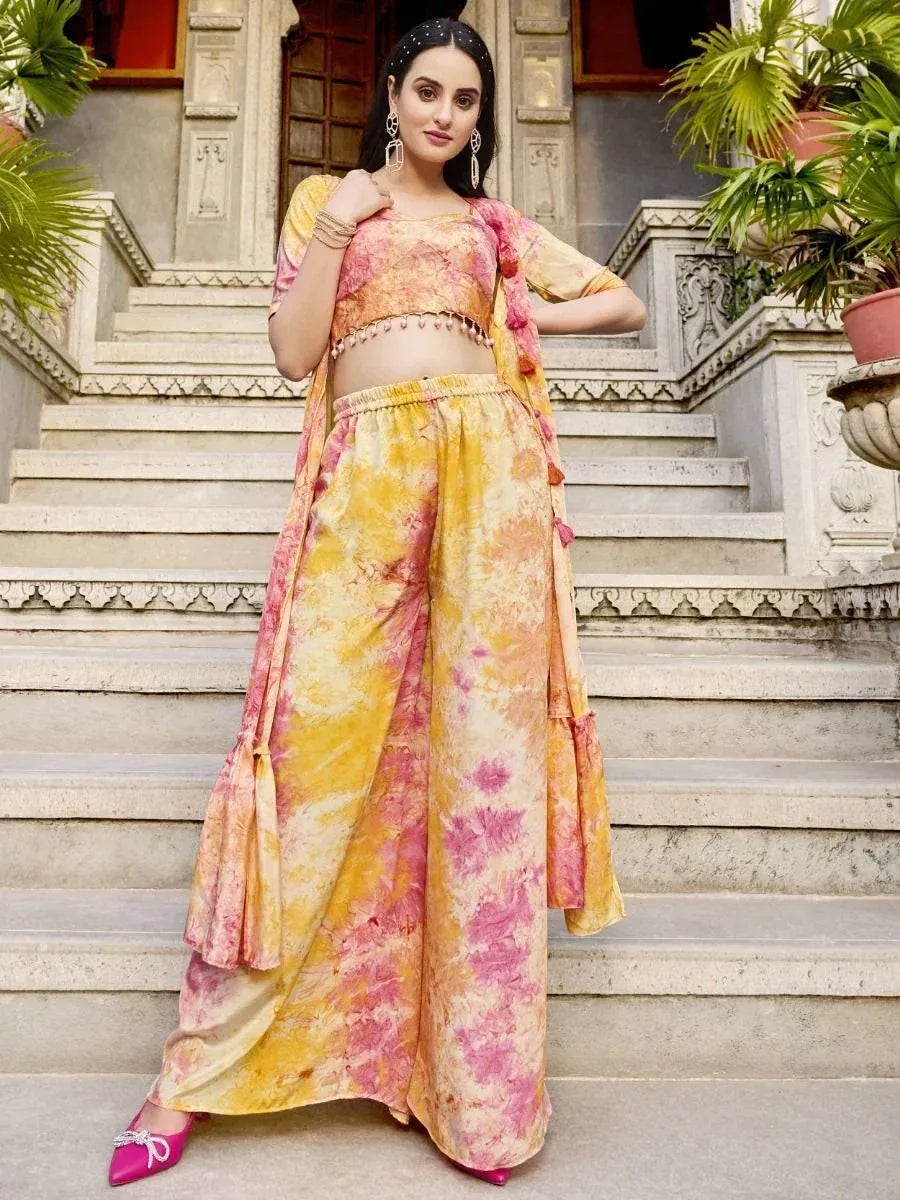 Woman in a yellow and pink tie-dye palazzo suit set with dupatta, traditional Indian wear