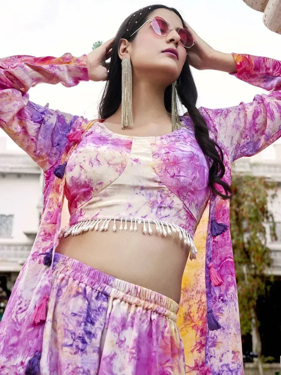 Vibrant tie-dye ethnic crop top with matching palazzo pants and tassel jacket, perfect for festive occasions.