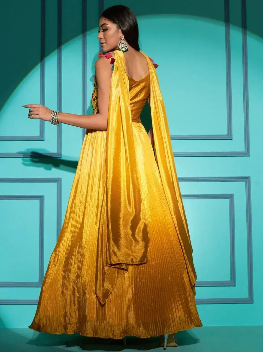 Yellow pleated ethnic gown with floral accents and dupatta, perfect for Indian festive occasions