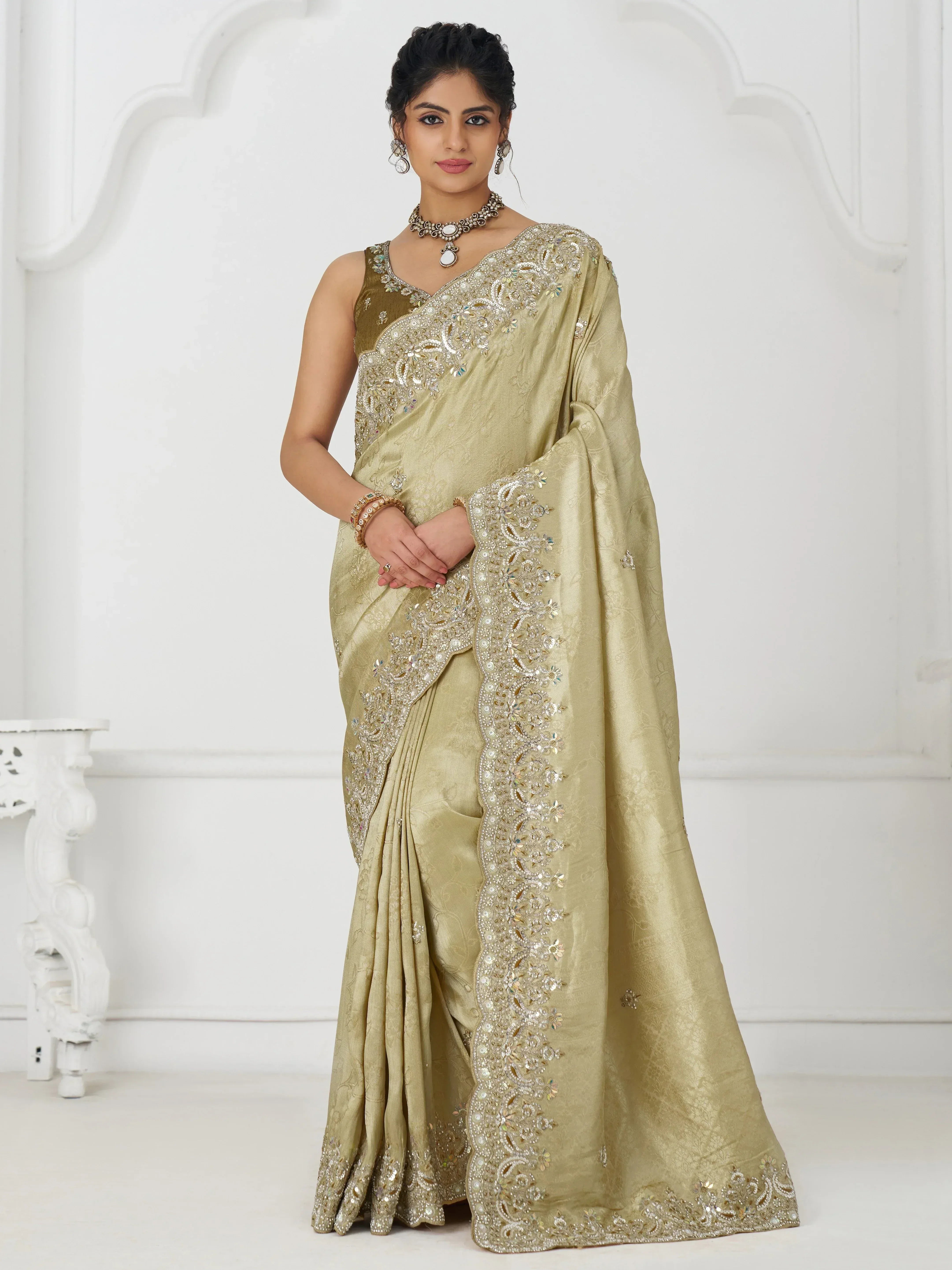 Elegant gold embroidered saree with designer blouse, perfect for Indian ethnic occasions and weddings