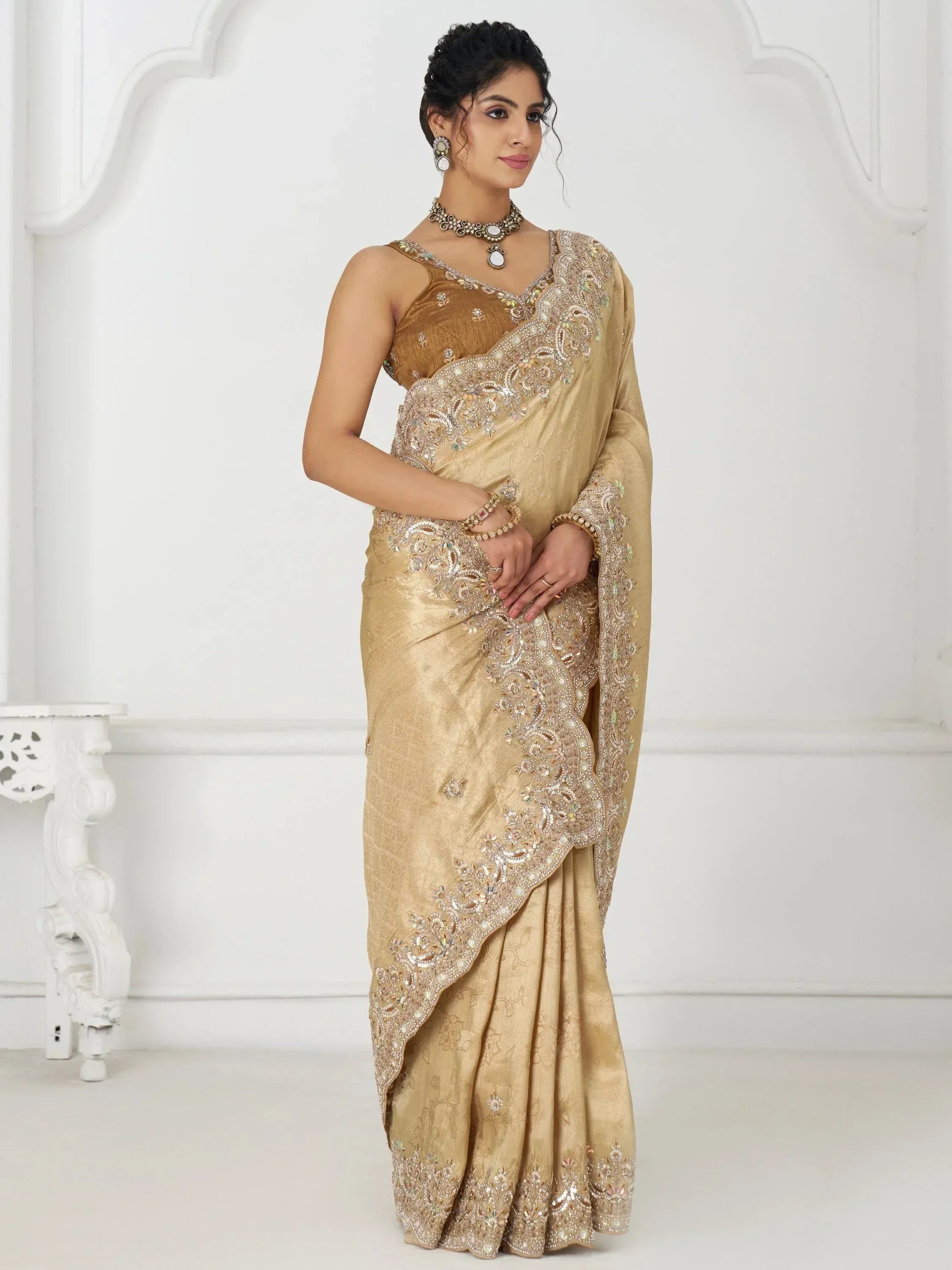 Elegant gold embroidered saree with designer blouse, perfect for Indian ethnic wear occasions