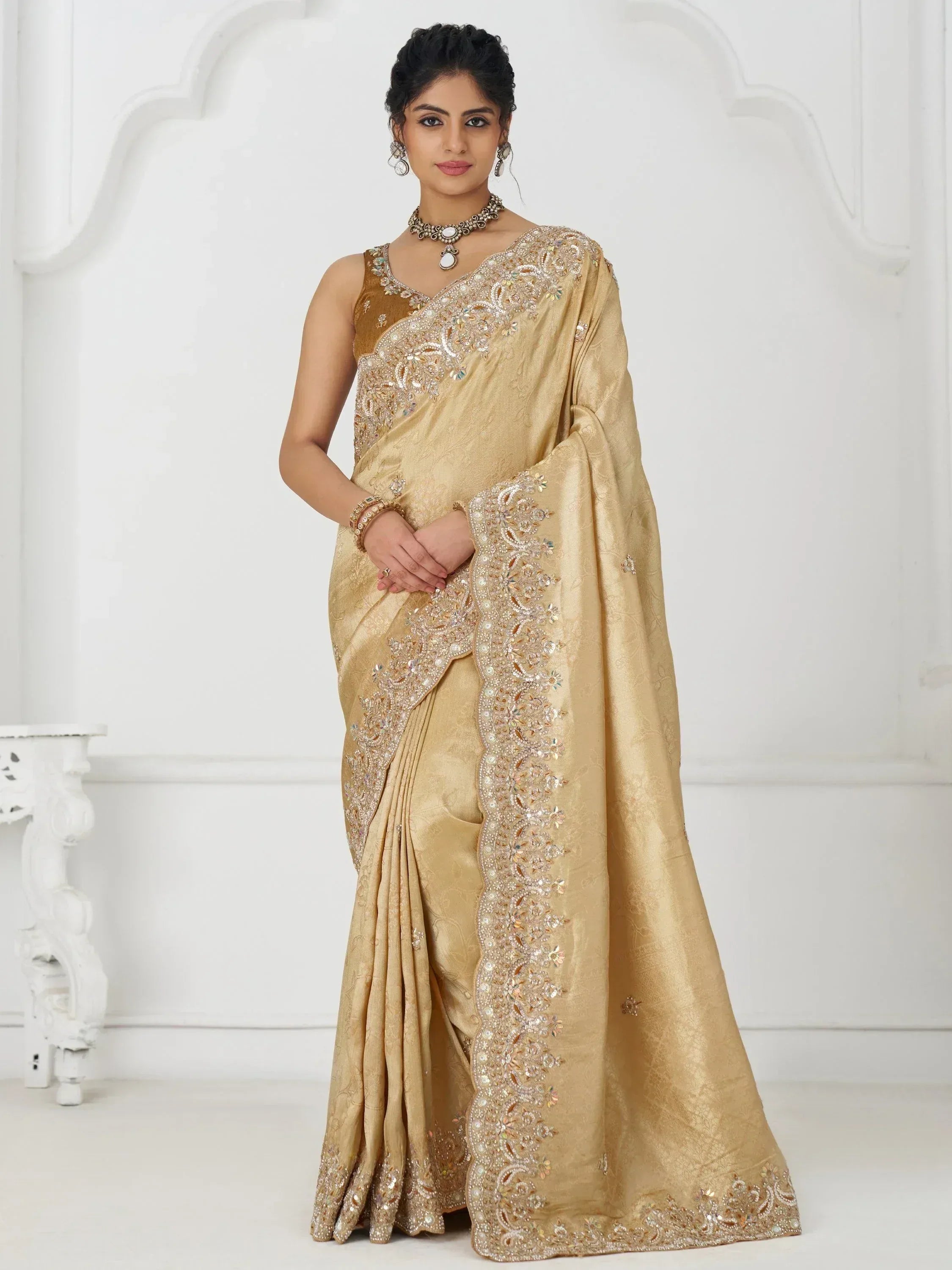Elegant gold embroidered saree with intricate beadwork, perfect for Indian ethnic wear occasions