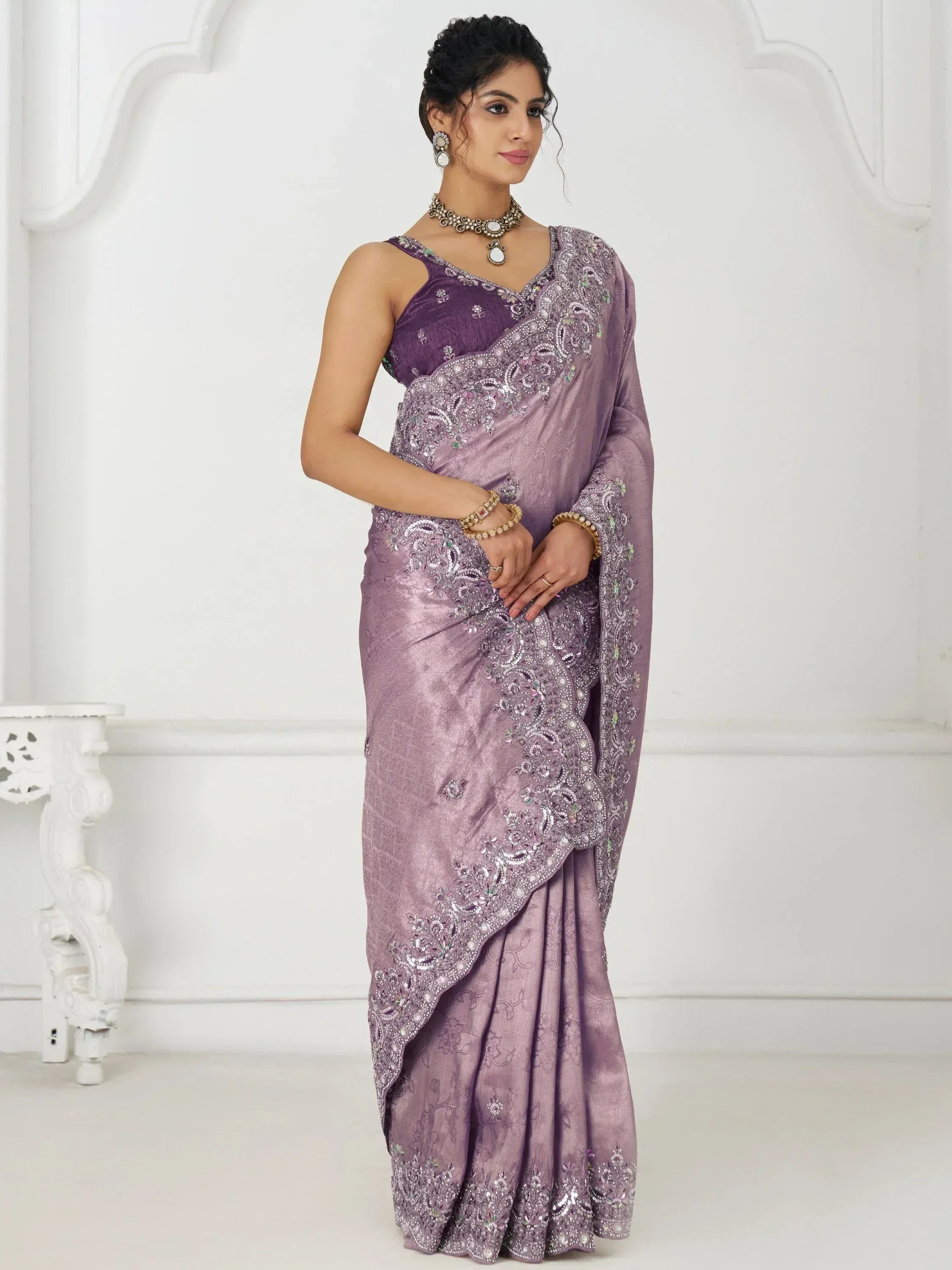 Elegant purple embroidered saree with designer blouse, perfect for Indian ethnic occasions