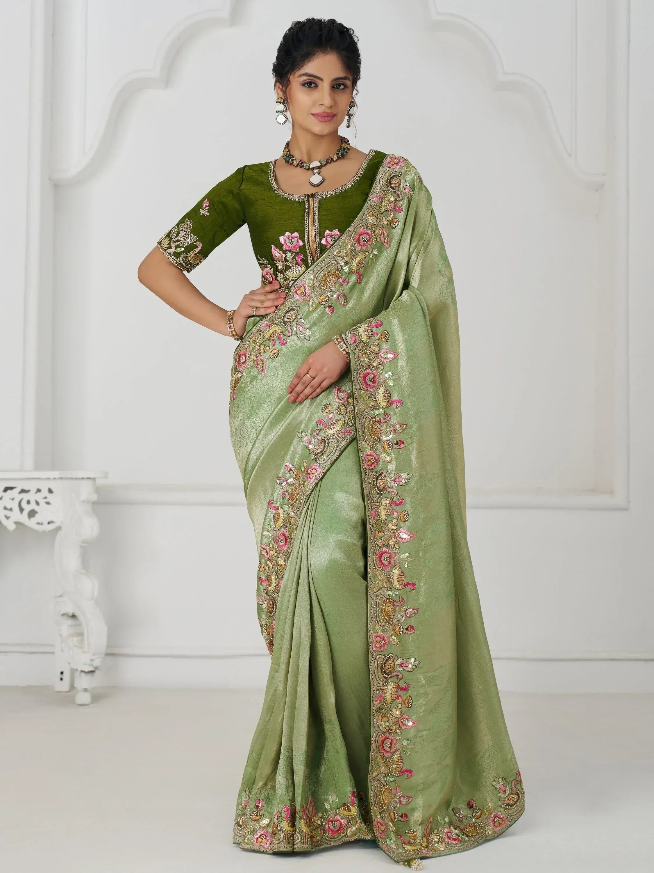 Green embroidered saree with floral and peacock motifs, perfect for Indian ethnic occasions