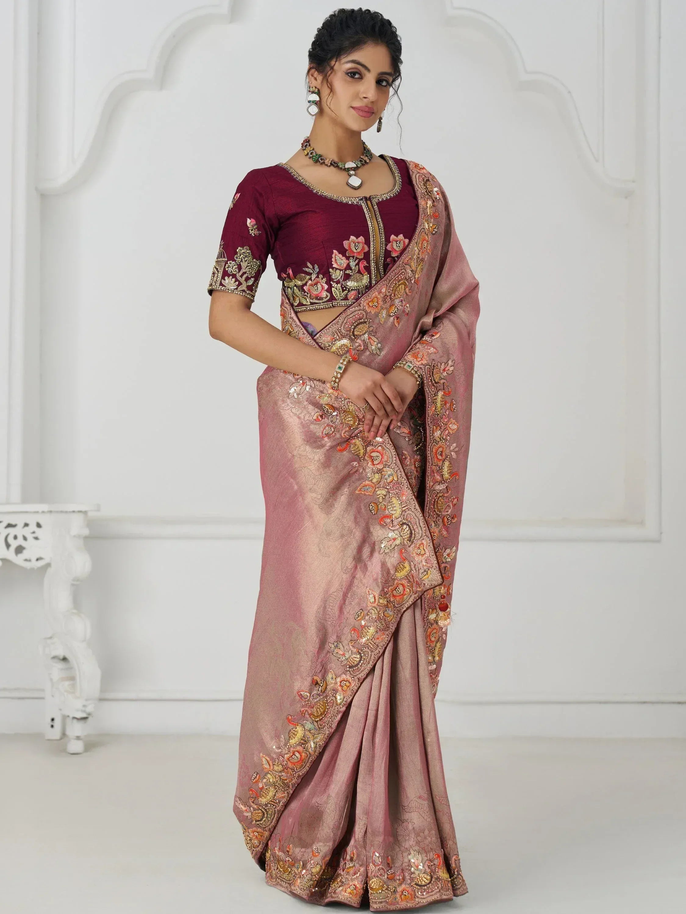 Elegant pink embroidered saree with maroon blouse, perfect for Indian ethnic occasions and festive wear.