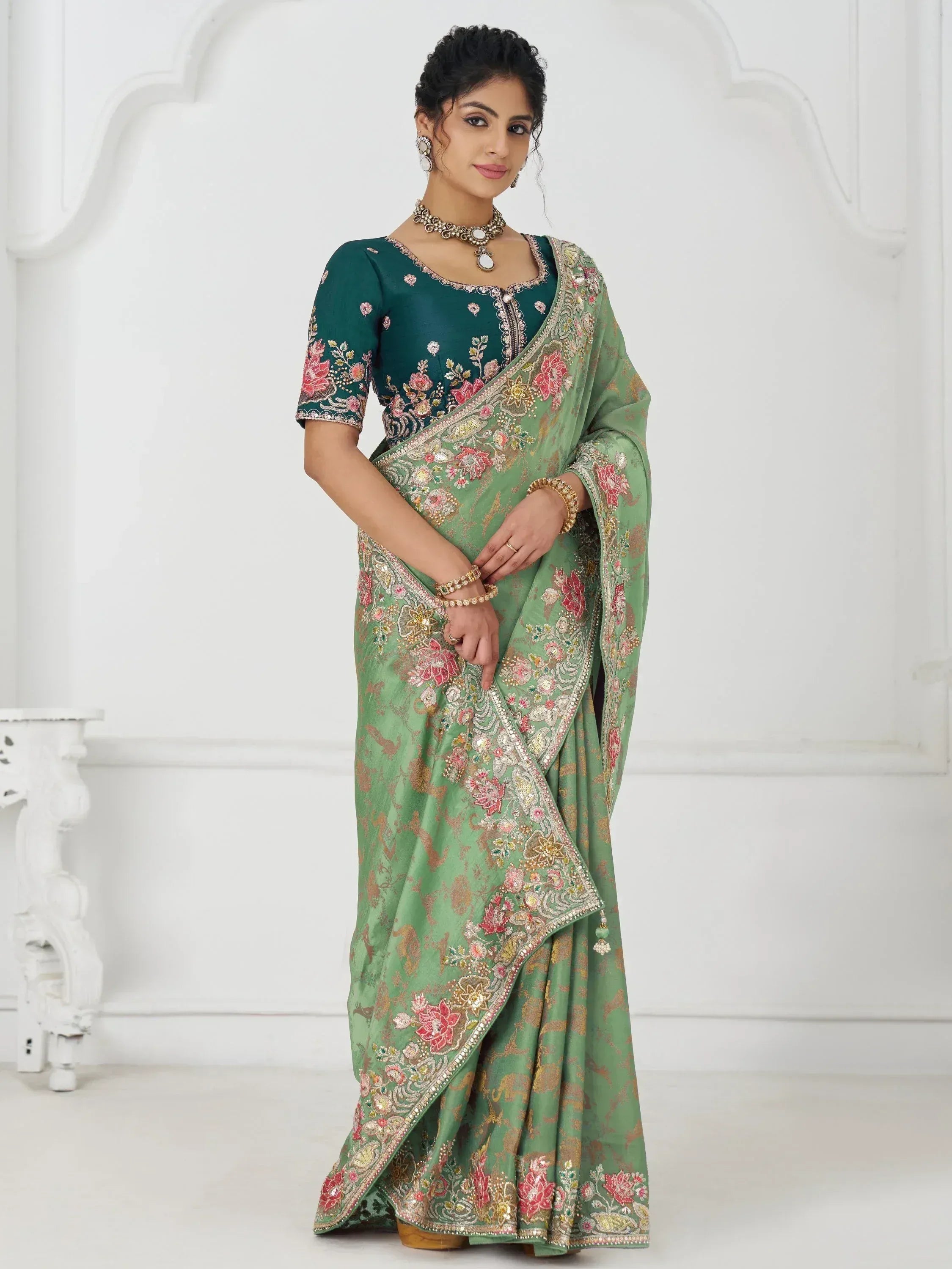 Green embroidered saree with floral design, perfect for Indian ethnic wear occasions