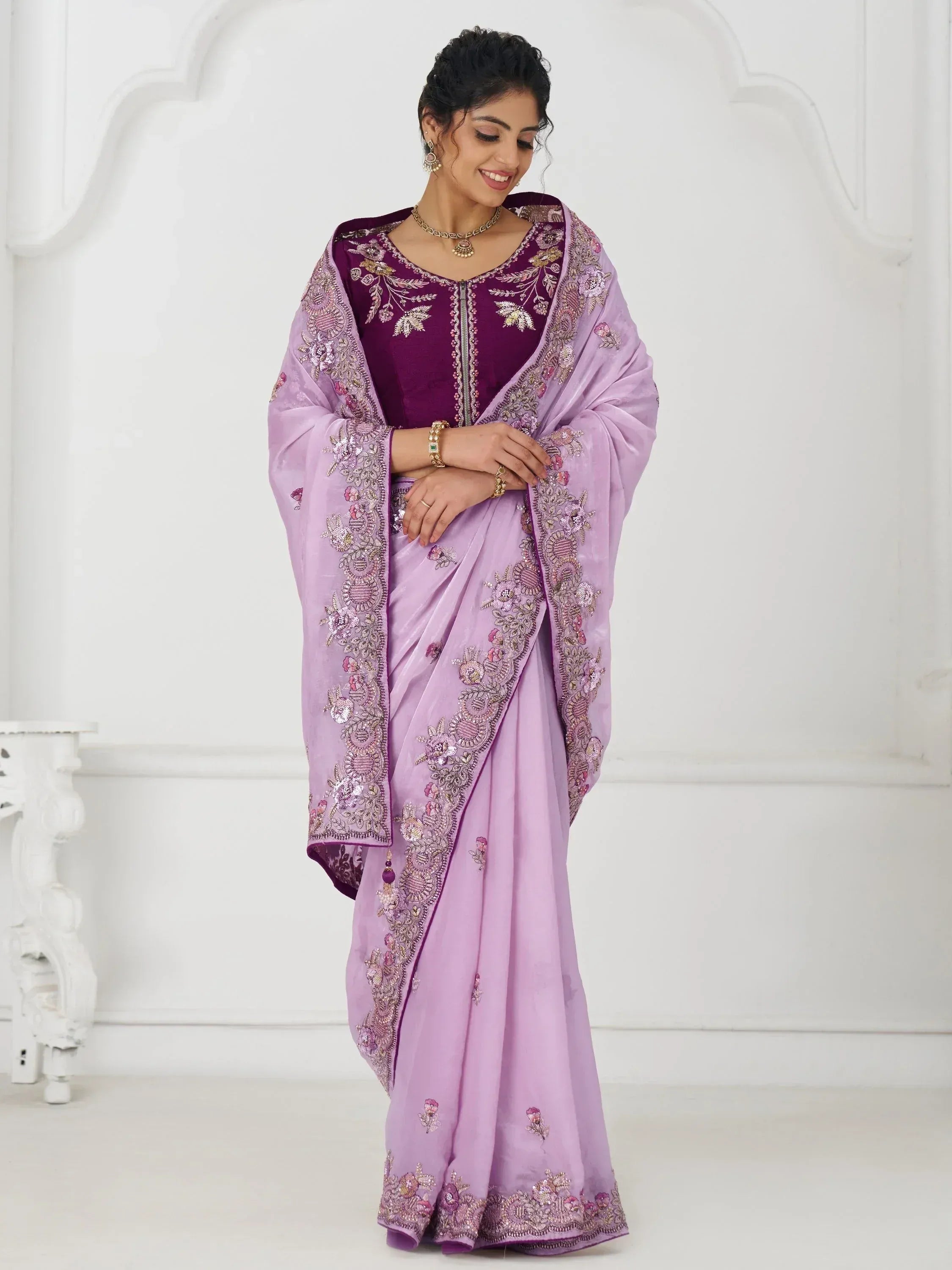 Lavender embroidered saree with purple velvet blouse, perfect for Indian ethnic wear occasions.