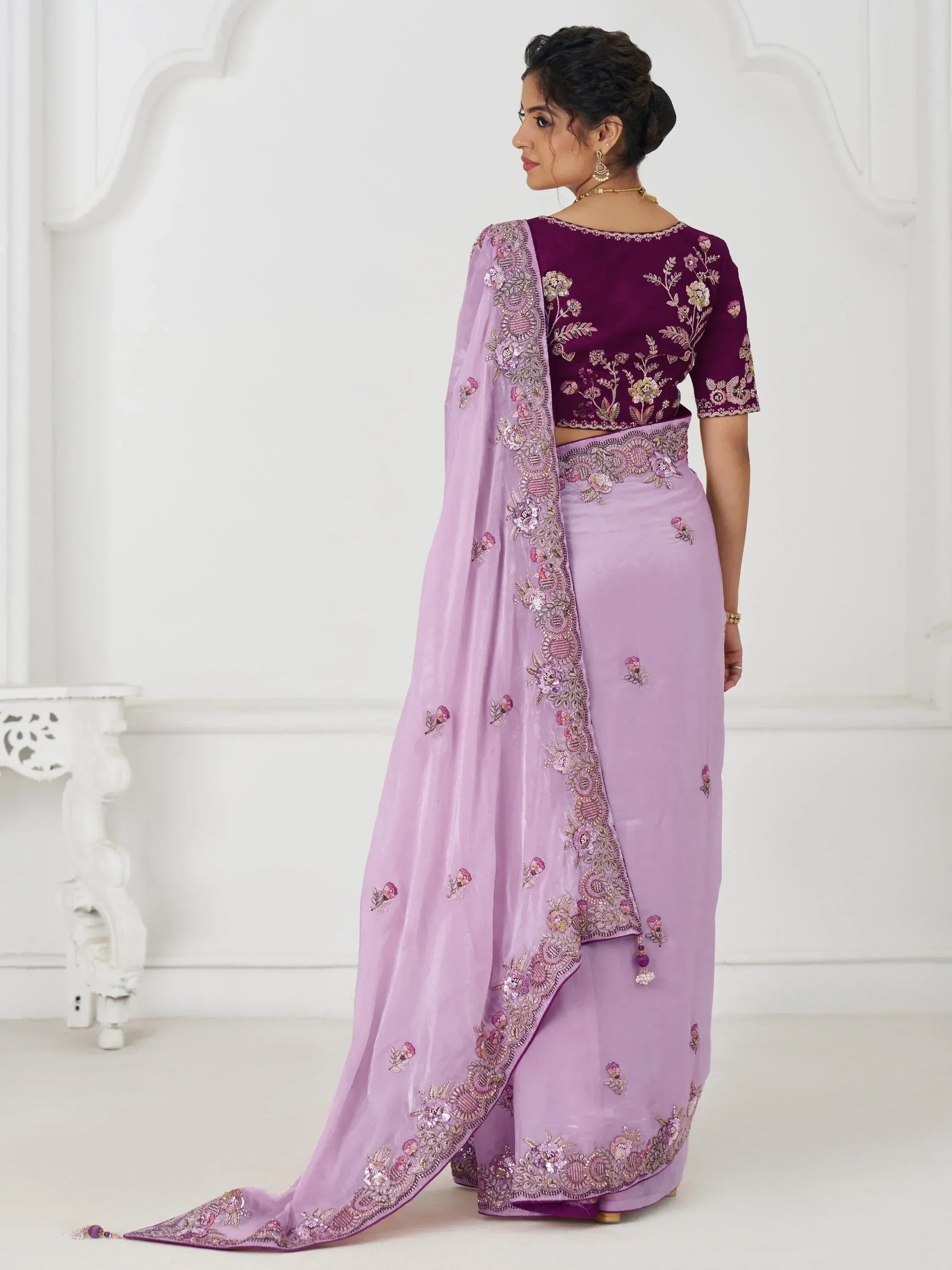 Purple embroidered lehenga choli with floral detailing, perfect for Indian ethnic wear occasions.