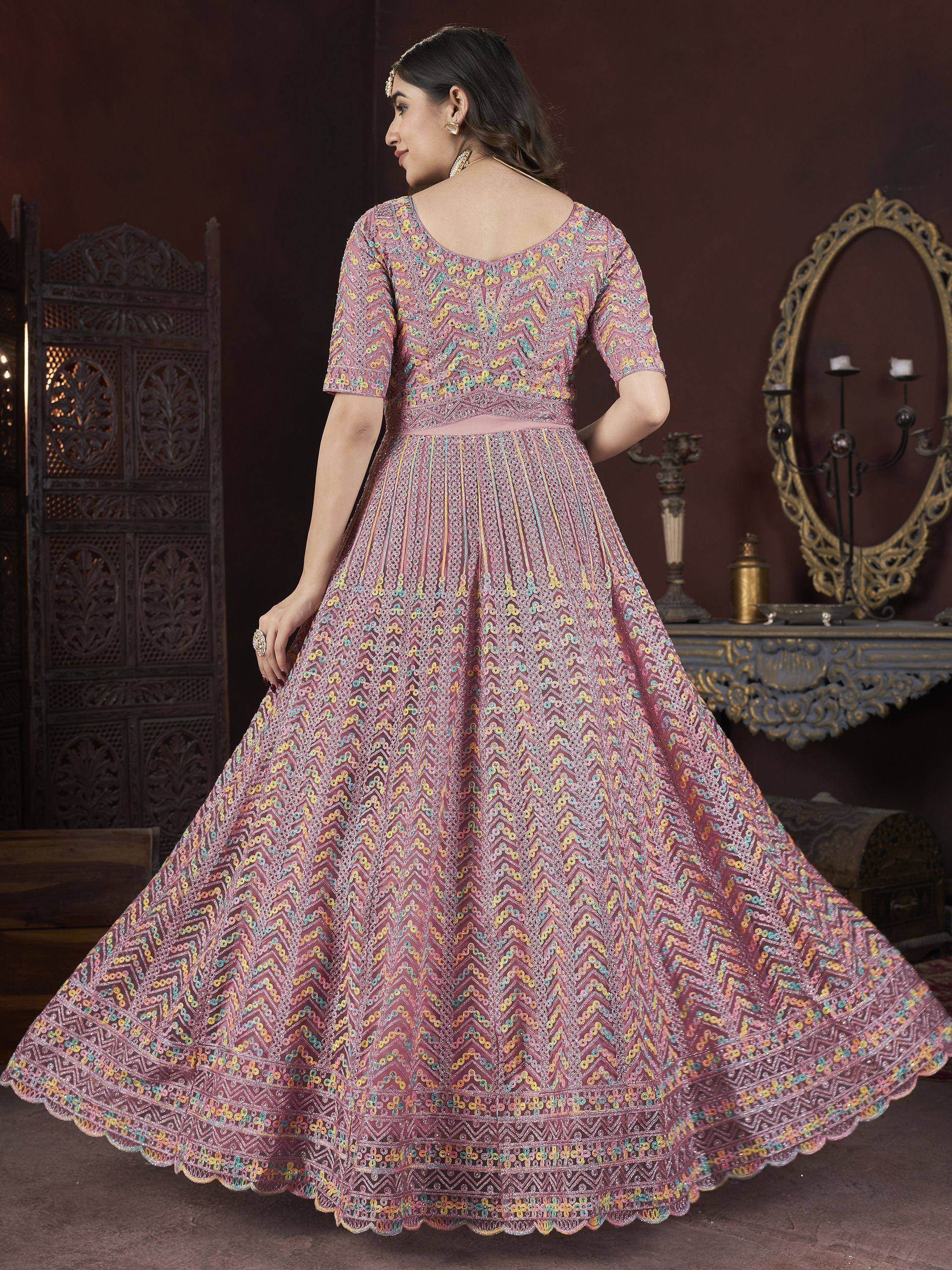 Elegant pink ethnic gown with colorful zigzag patterns and scalloped hem for festive occasions