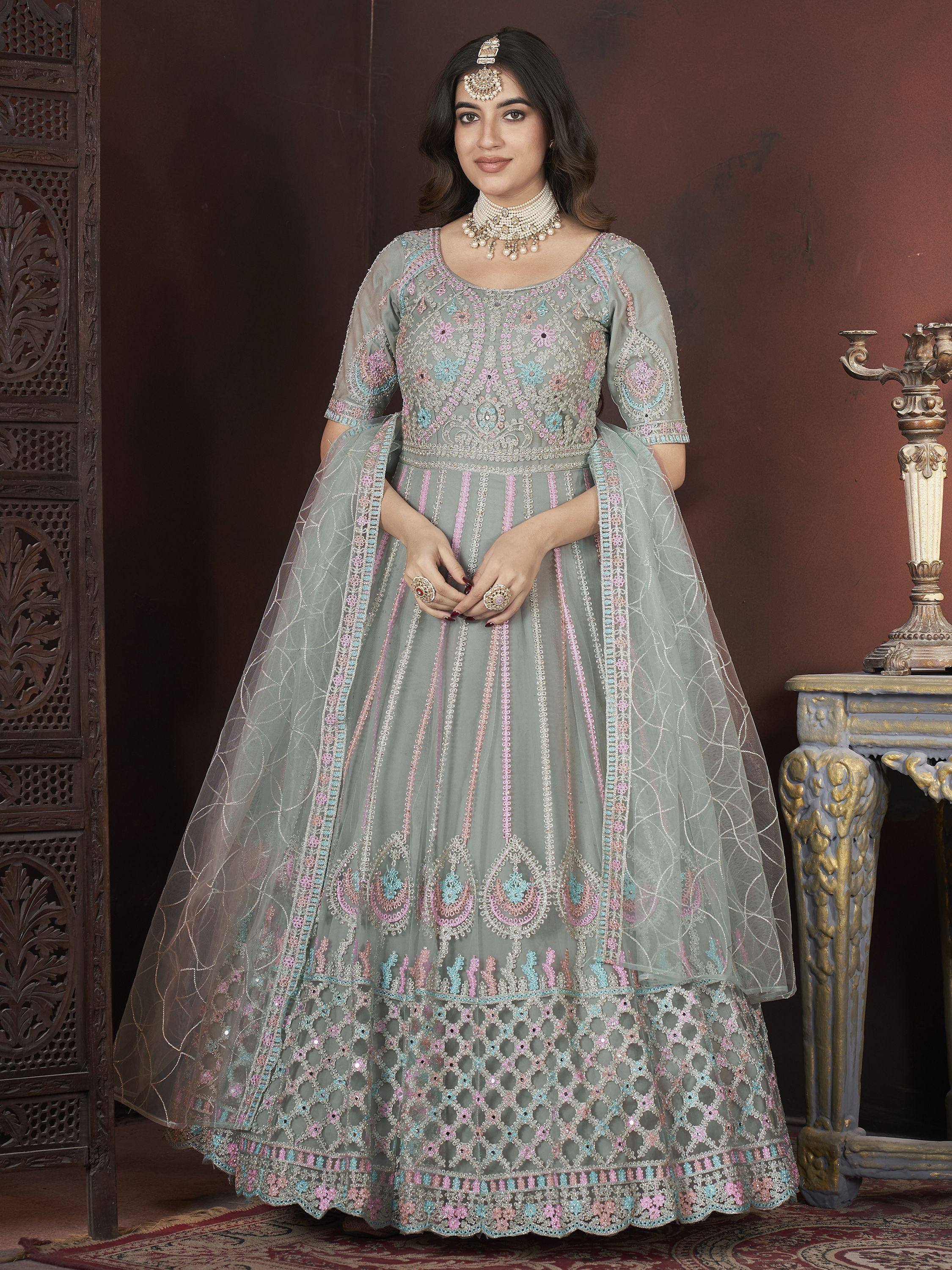 Grey embroidered lehenga choli with pastel floral motifs, perfect for Indian weddings and festive occasions.