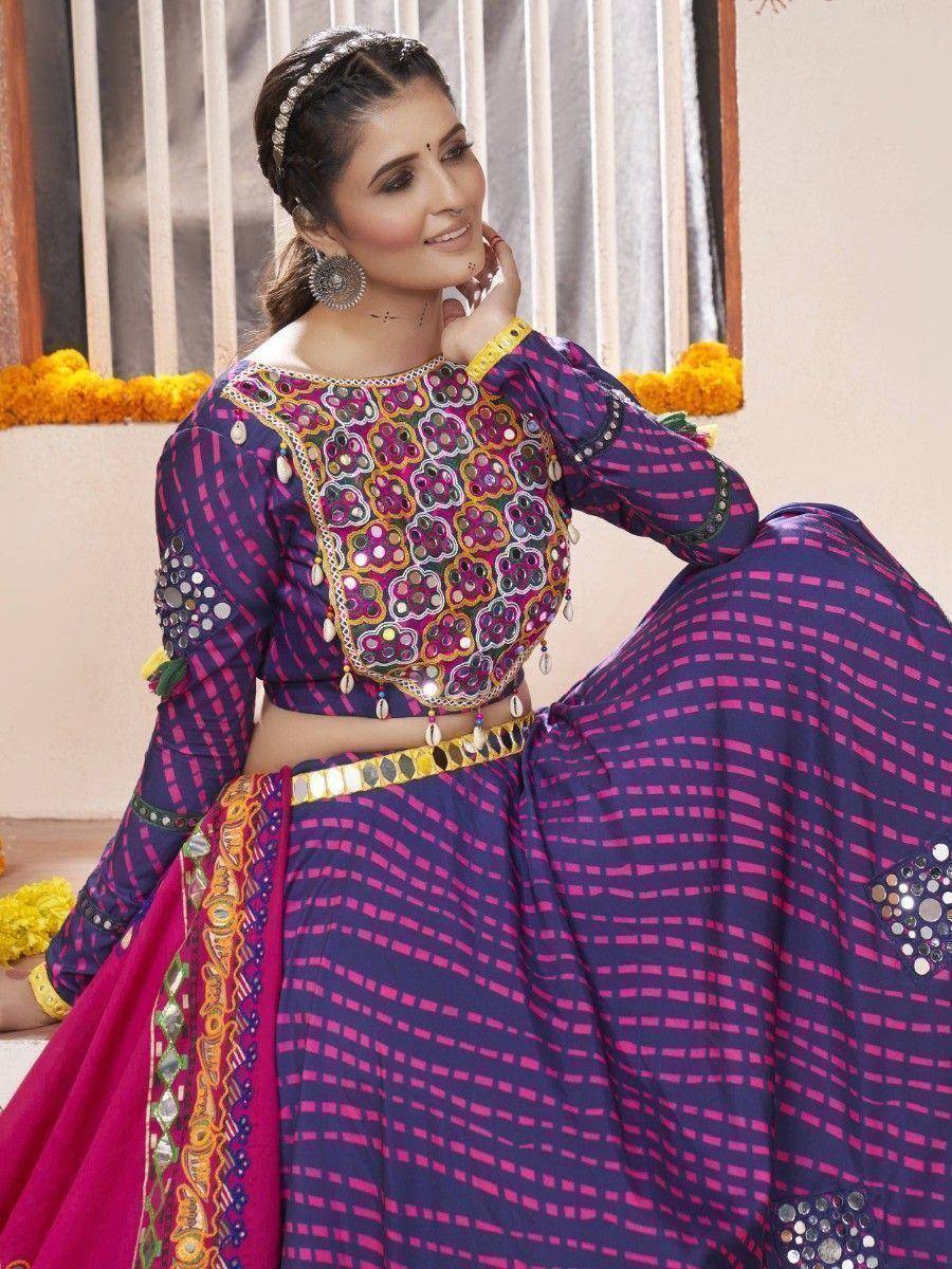 Purple and pink ethnic lehenga choli with mirror work and floral embroidery, perfect for Indian celebrations