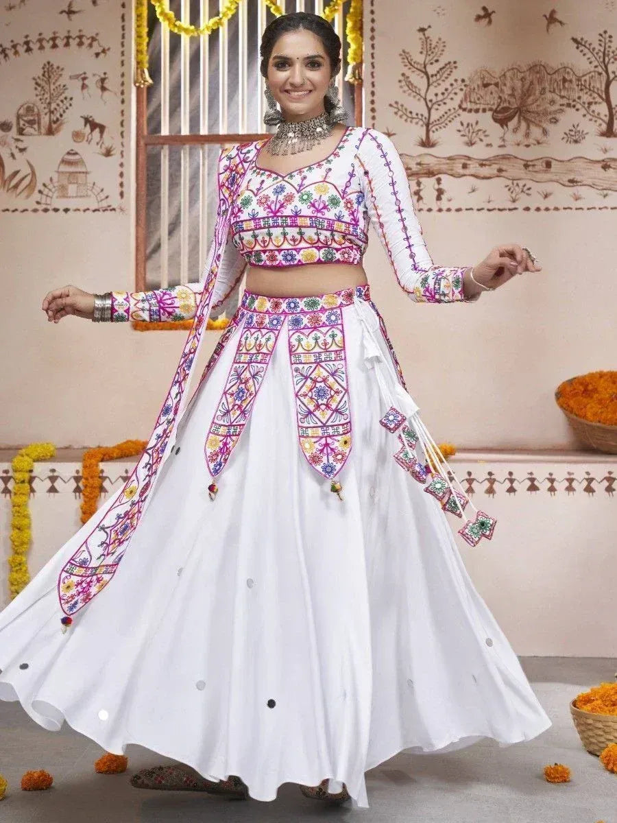 White embroidered lehenga choli with colorful mirror work, perfect for Indian ethnic wear and festive occasions