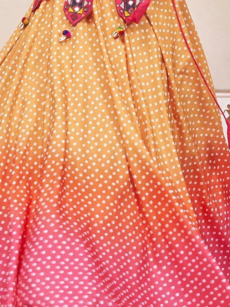 Ombre yellow to pink ethnic lehenga with white dot print and embroidered details