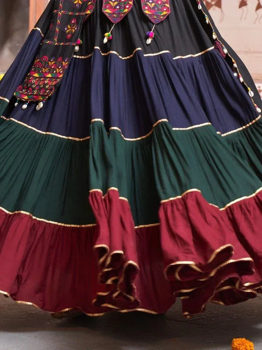 Colorful tiered ethnic lehenga skirt with embroidery and mirror work, perfect for Indian festivals