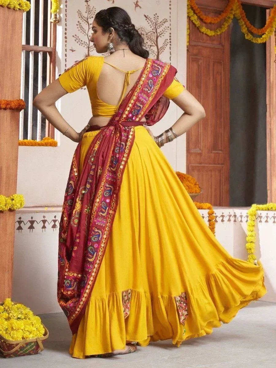Yellow lehenga choli with maroon dupatta, ethnic Indian wear for festive occasions